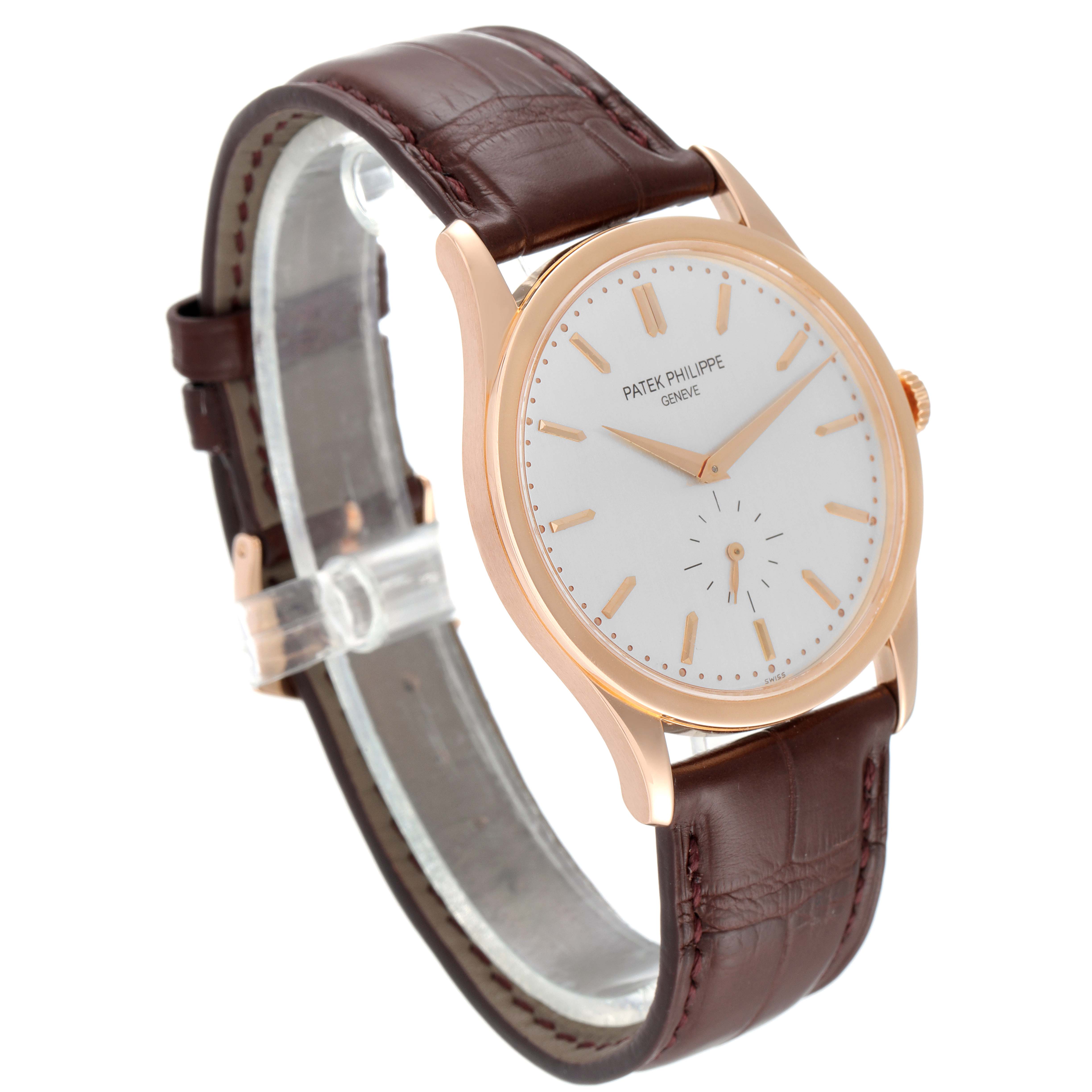 The image shows a side angle view of a Patek Philippe Calatrava 5196R Men's Rose Gold Silver Dial 5196R Men's Rose Gold Silver Dial watch, featuring a brown leather strap and a white dial.
