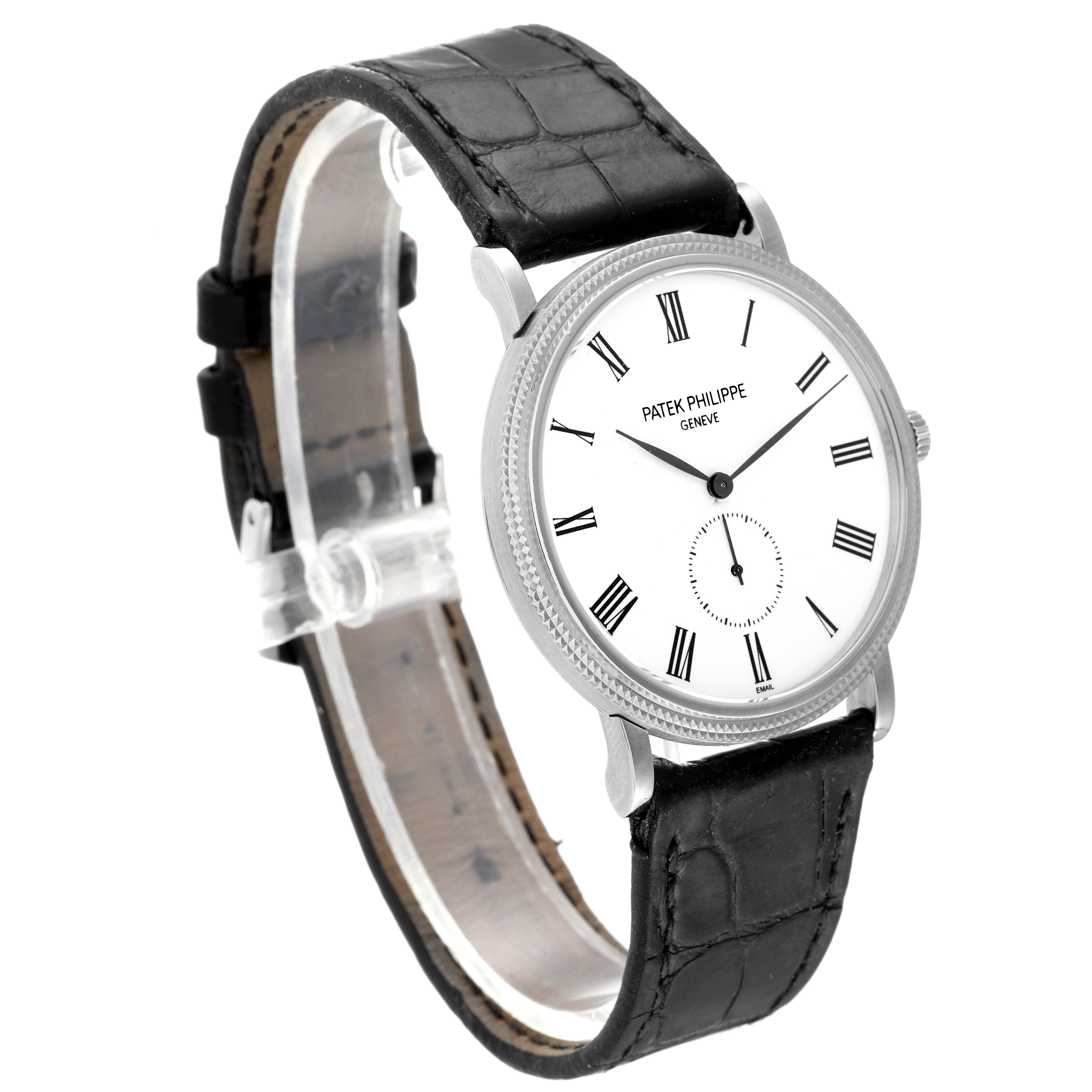 The image shows a Patek Philippe Calatrava 5119G Men
s White Gold White Dial 5119G Men
s White Gold White Dial wristwatch from a front-left angle, displaying the face and black leather strap.