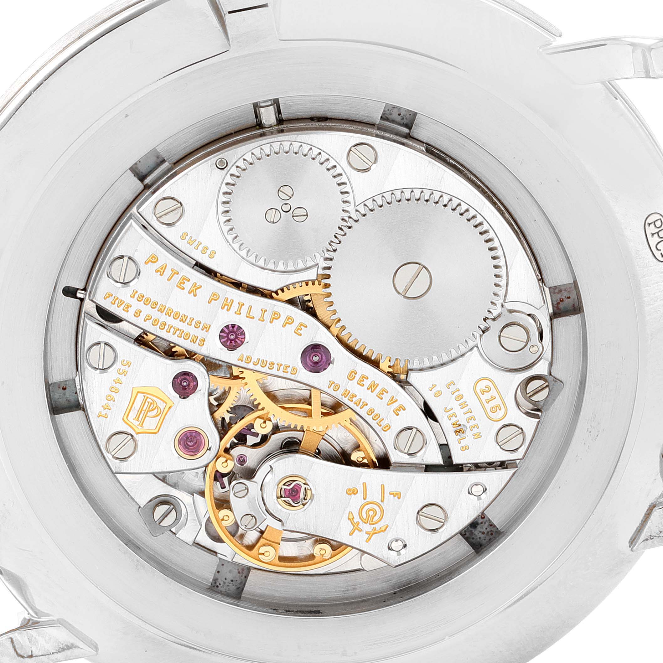 The image shows the intricate movement and inner gears of a Patek Philippe Calatrava 5119G Men
s White Gold White Dial 5119G Men
s White Gold White Dial watch, viewed from the back.