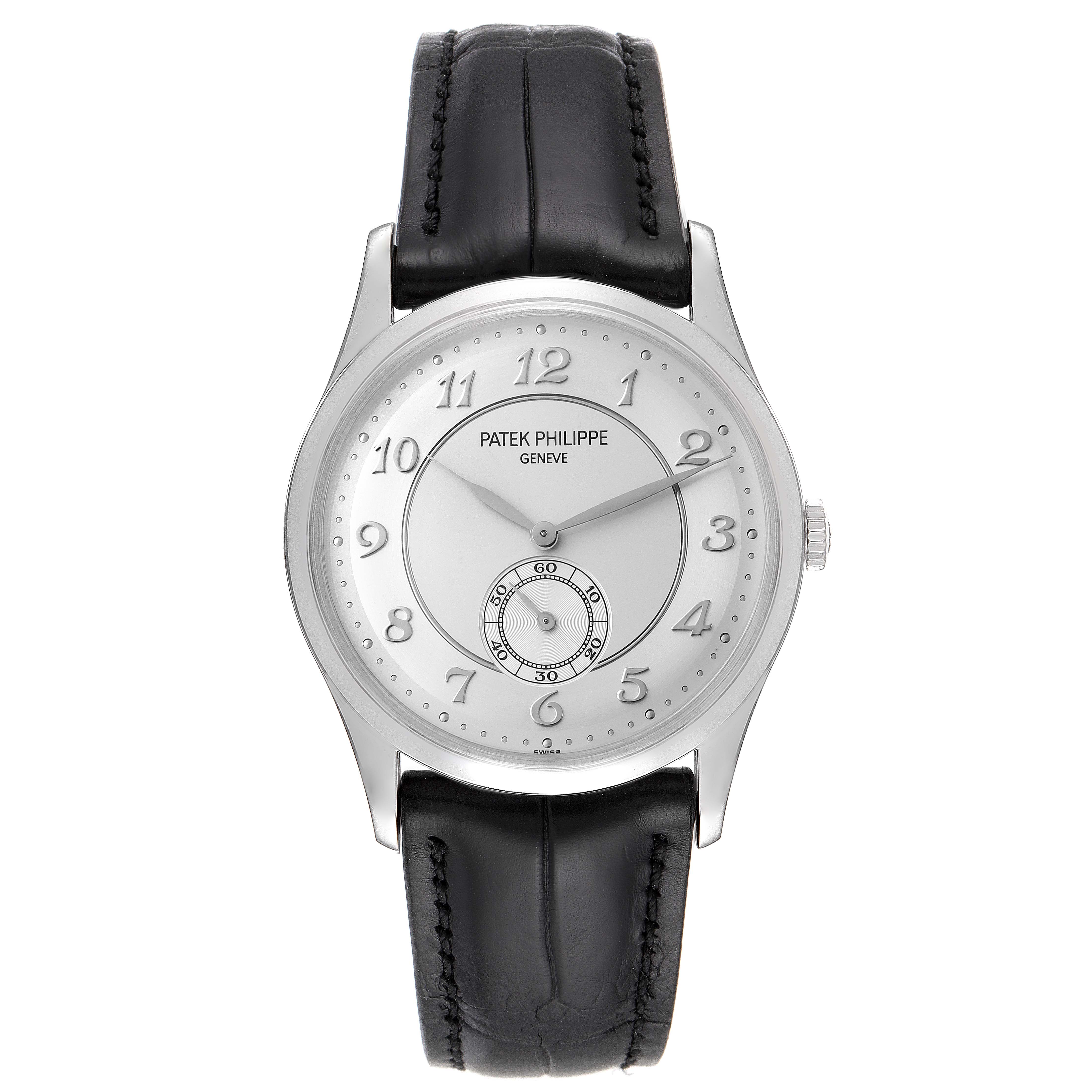 The image shows a frontal view of the Patek Philippe Calatrava 5196P-001 Men's Platinum Silver Dial 5196P-001 Men's Platinum Silver Dial watch, highlighting its dial, numerals, hands, and black leather strap.