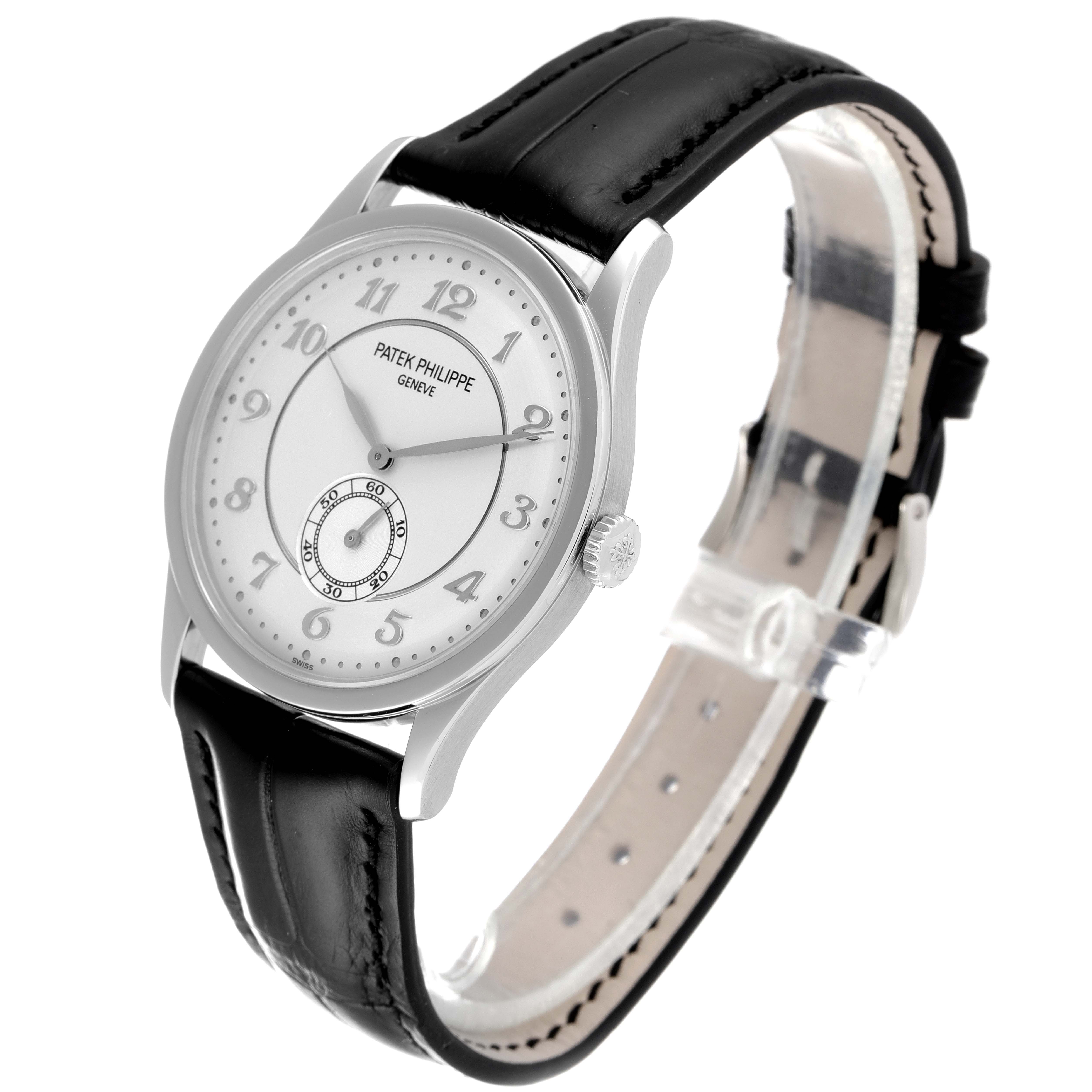 The image shows a front angle of the Patek Philippe Calatrava 5196P-001 Men's Platinum Silver Dial 5196P-001 Men's Platinum Silver Dial watch, highlighting its dial, case, crown, and leather strap.