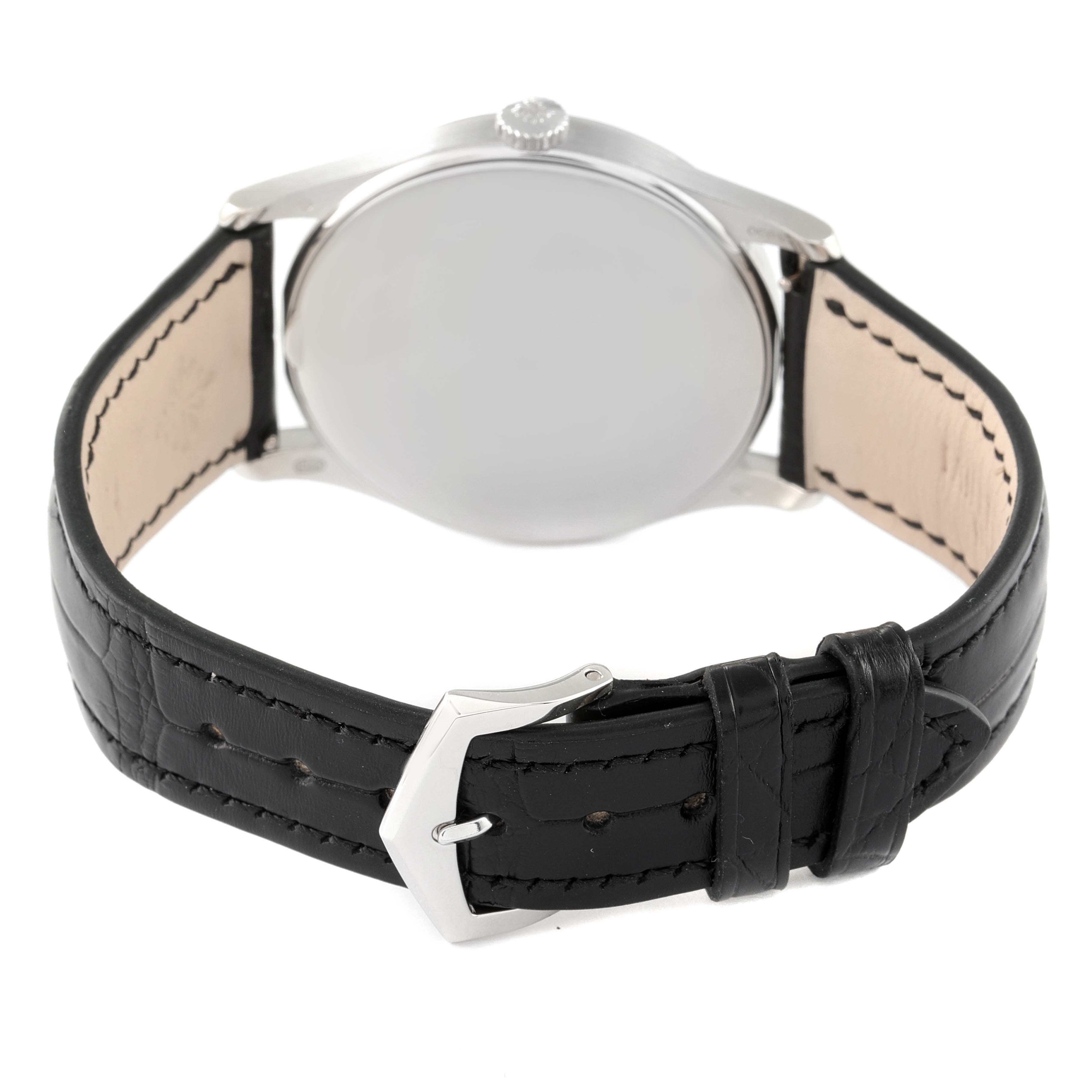 The image shows the back view of a Patek Philippe Calatrava 5196P-001 Men's Platinum Silver Dial 5196P-001 Men's Platinum Silver Dial watch with a black leather strap and silver buckle.