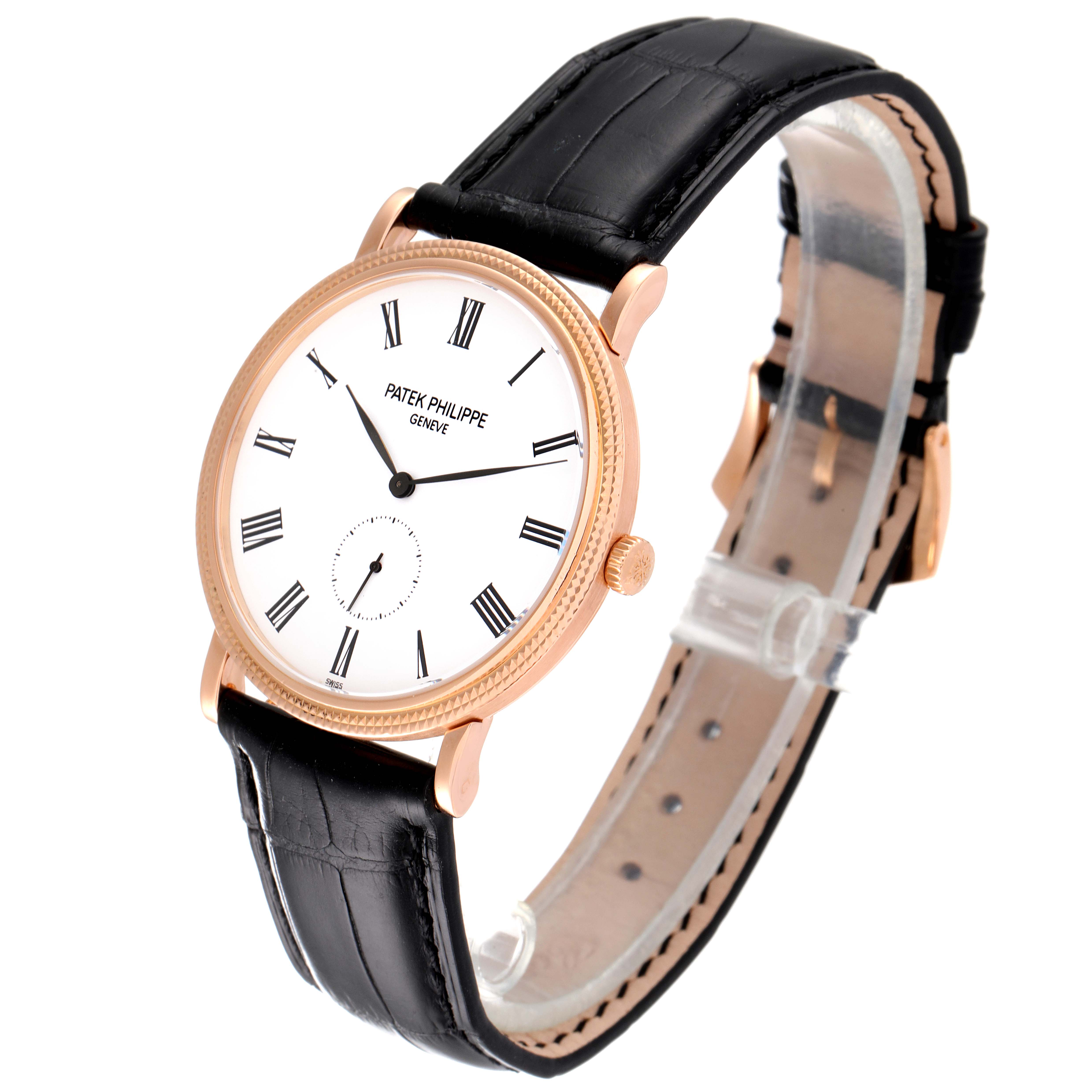 The image shows the Patek Philippe Calatrava 5119R Men's Rose Gold White Dial 5119R Men's Rose Gold White Dial watch from a three-quarter side angle, highlighting its face, bezel, crown, and strap.