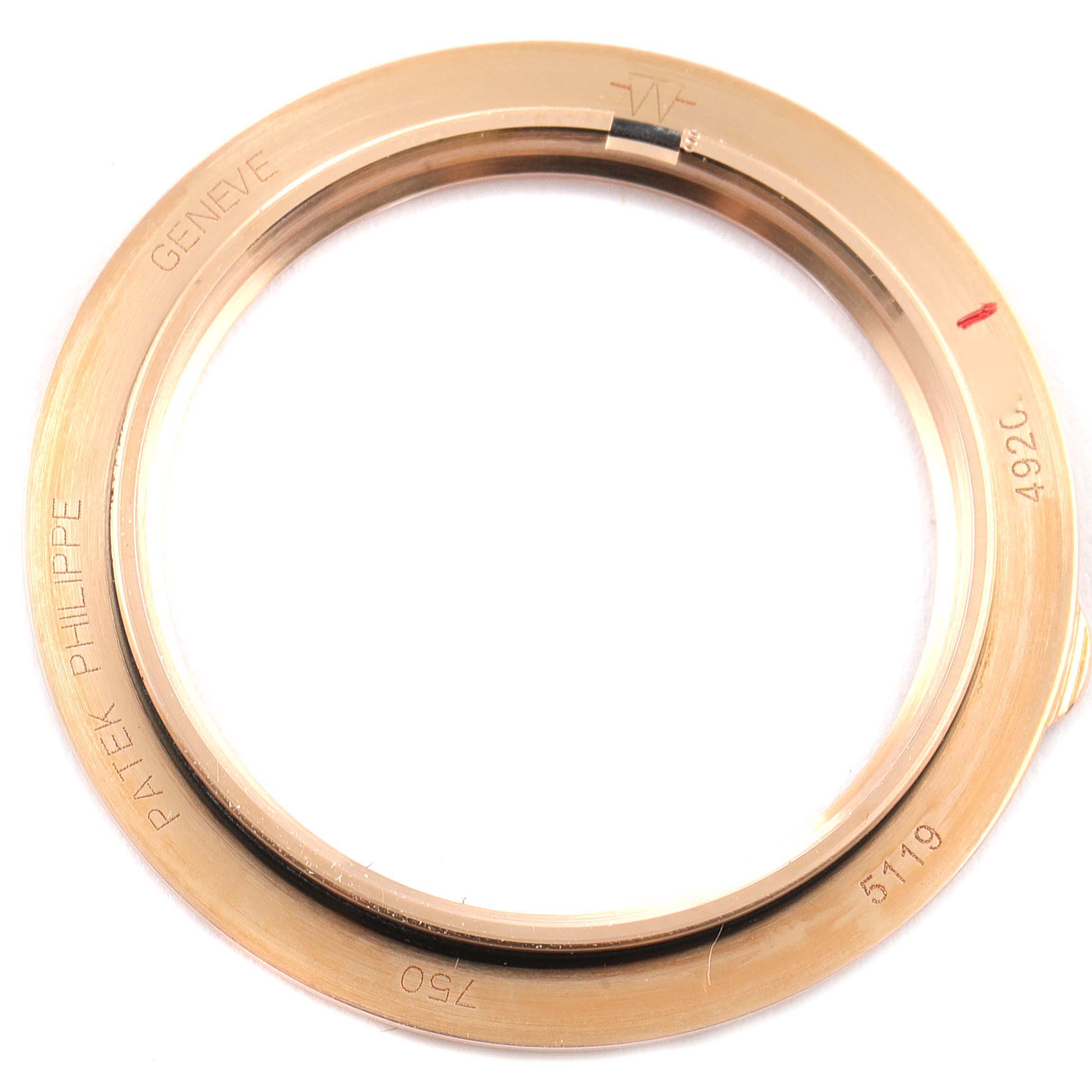 The image shows the bezel of a Patek Philippe Calatrava 5119R Men's Rose Gold White Dial 5119R Men's Rose Gold White Dial model, with inscriptions including "GENEVE," "PATEK PHILIPPE," and model number "5119."