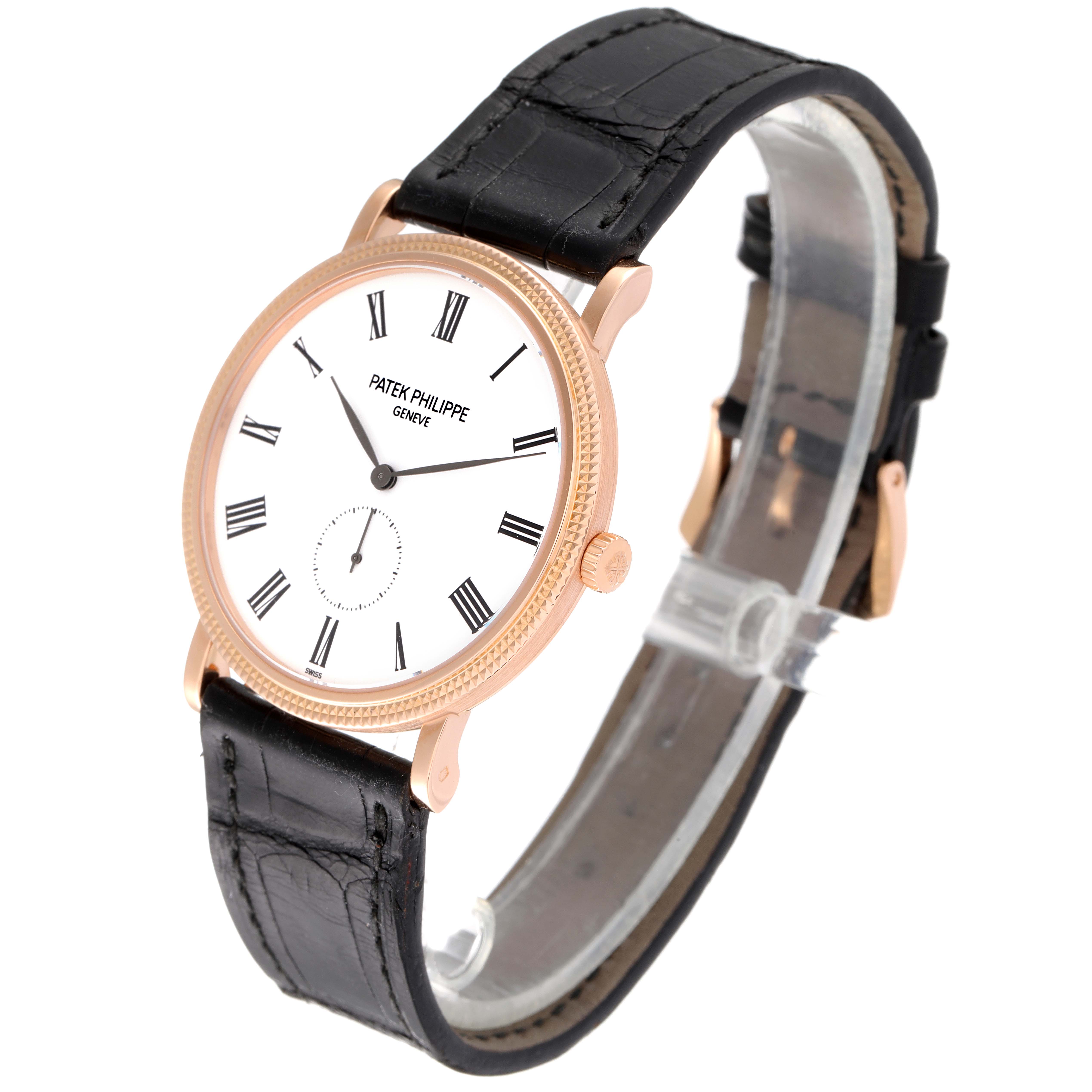 The image shows a Patek Philippe Calatrava 5119R Men's Rose Gold White Dial 5119R Men's Rose Gold White Dial watch at an angled view, highlighting its face, bezel, and leather strap.