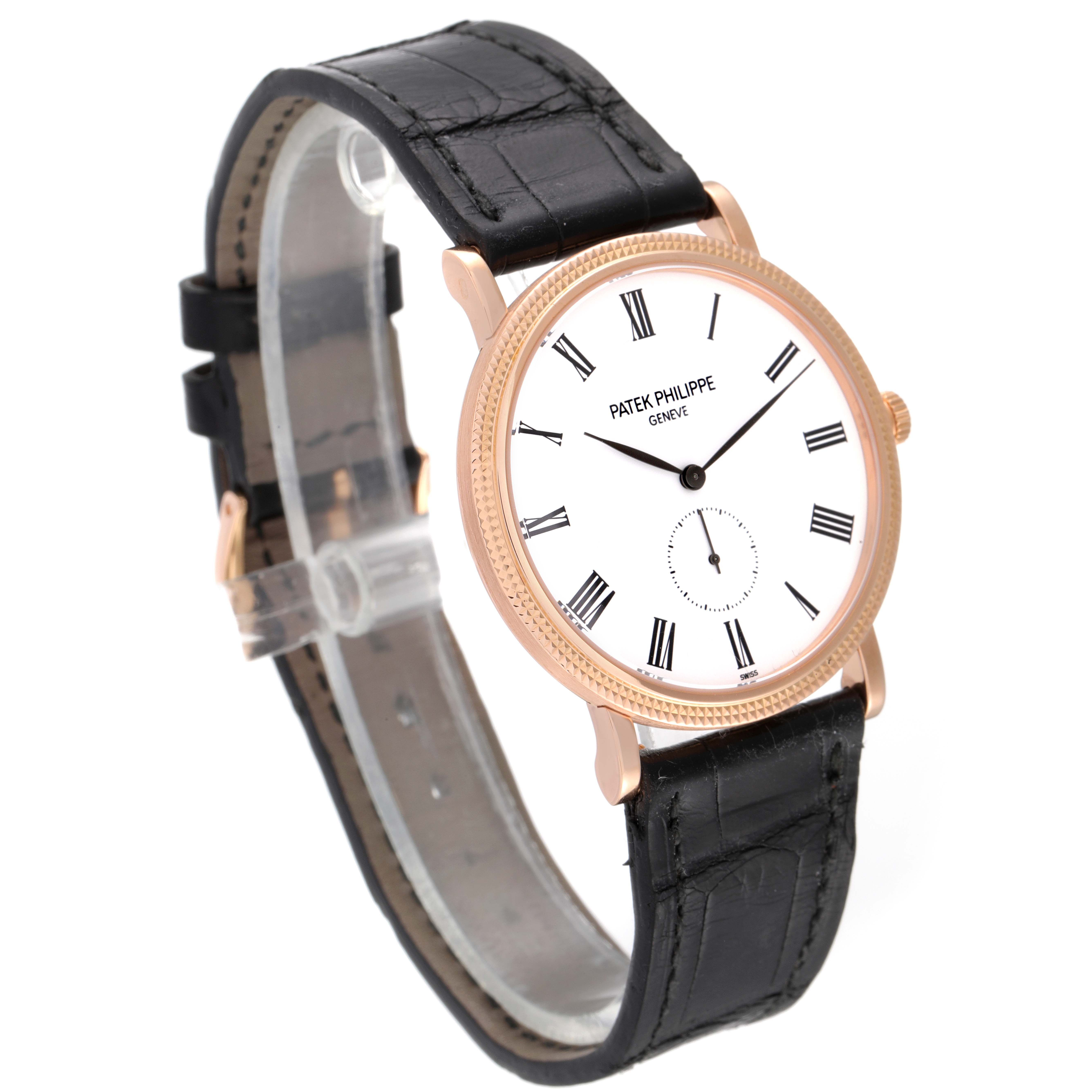 The image shows a Patek Philippe Calatrava 5119R Men's Rose Gold White Dial 5119R Men's Rose Gold White Dial watch at a 3/4 angle, highlighting its face, strap, and buckle.