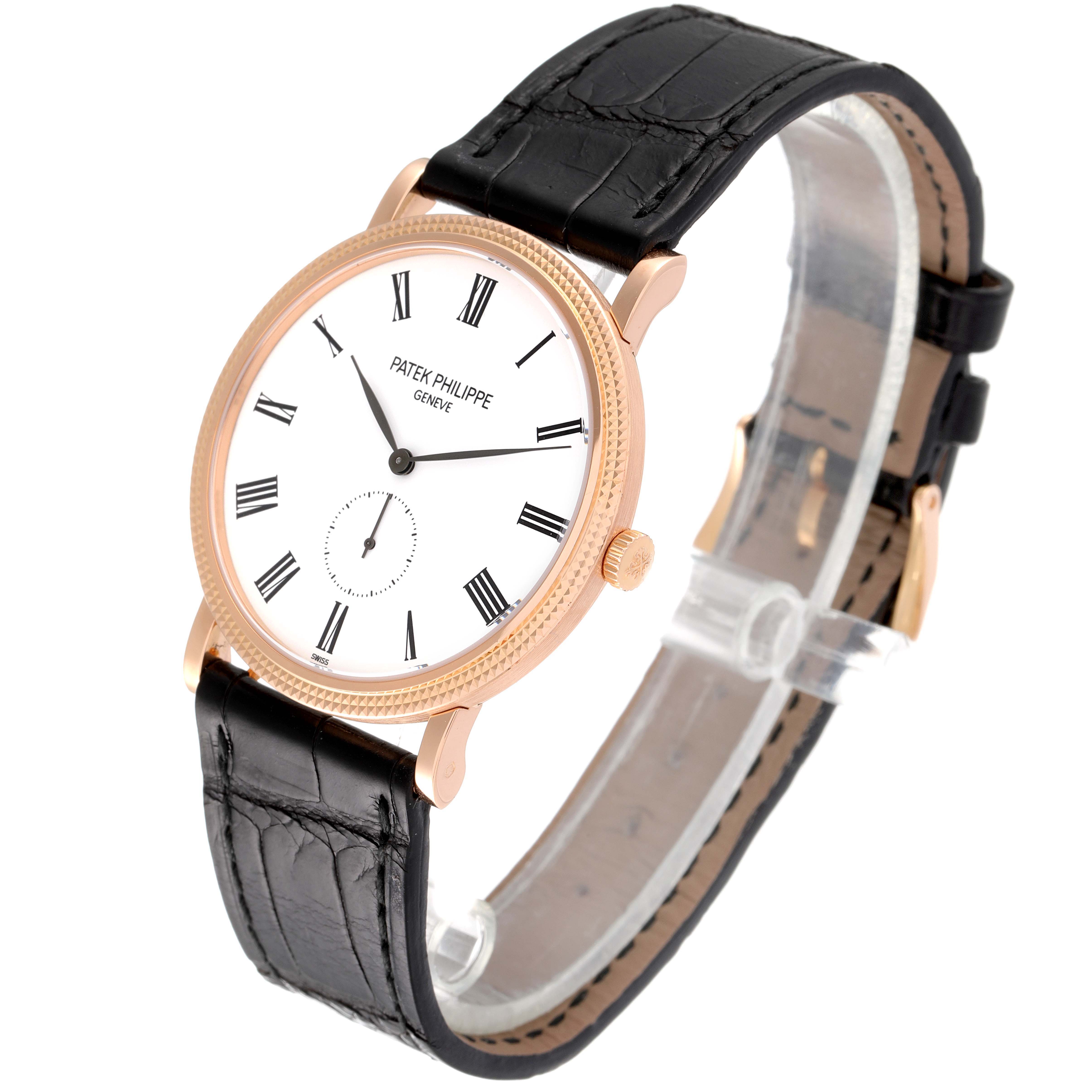 The image shows a Patek Philippe Calatrava 5119R Men's Rose Gold White Dial 5119R Men's Rose Gold White Dial model wristwatch, angled slightly to the right, highlighting the watch face, crown, and black leather strap.