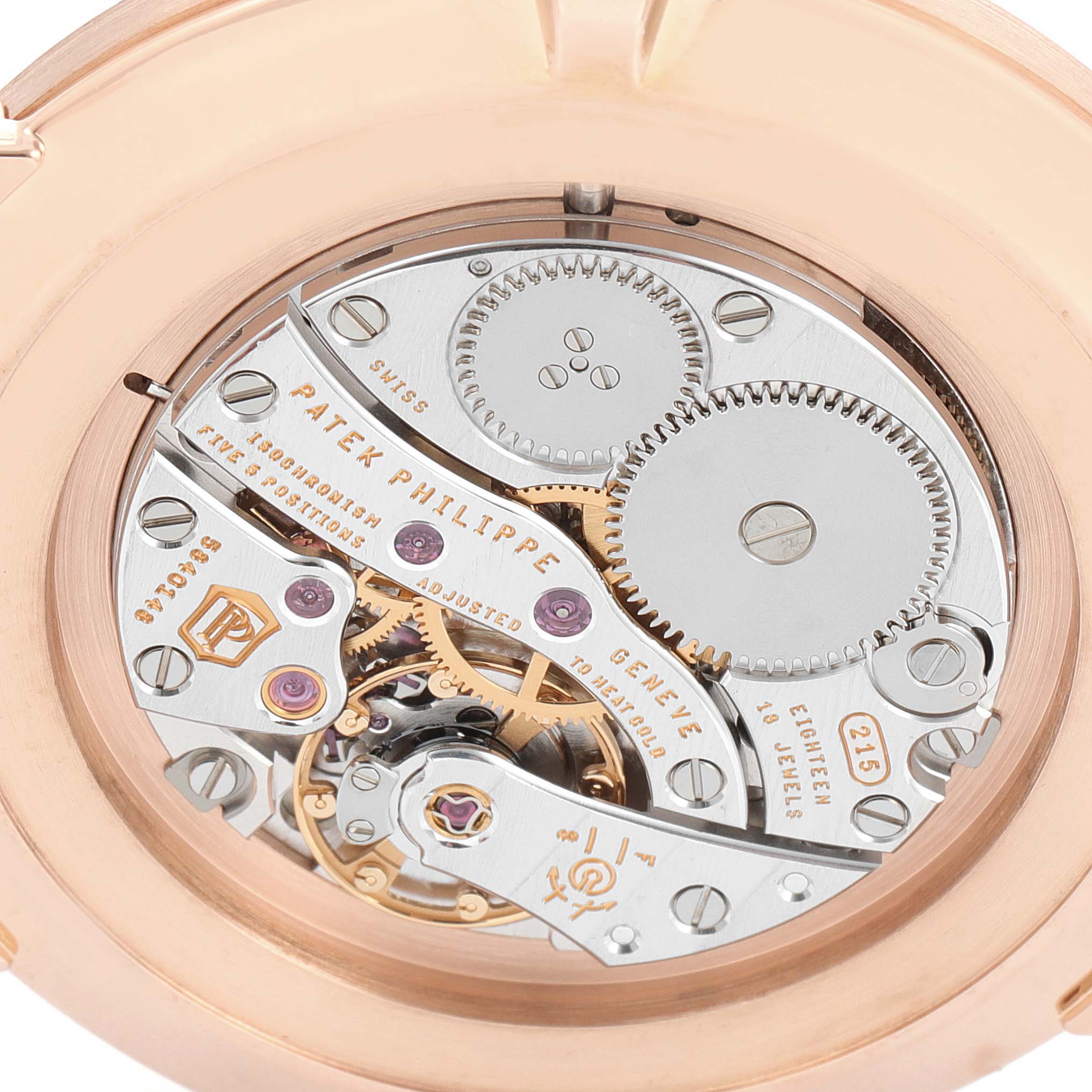 This image shows a close-up of the movement mechanism of a Patek Philippe Calatrava 5119R Men's Rose Gold White Dial 5119R Men's Rose Gold White Dial watch from behind.