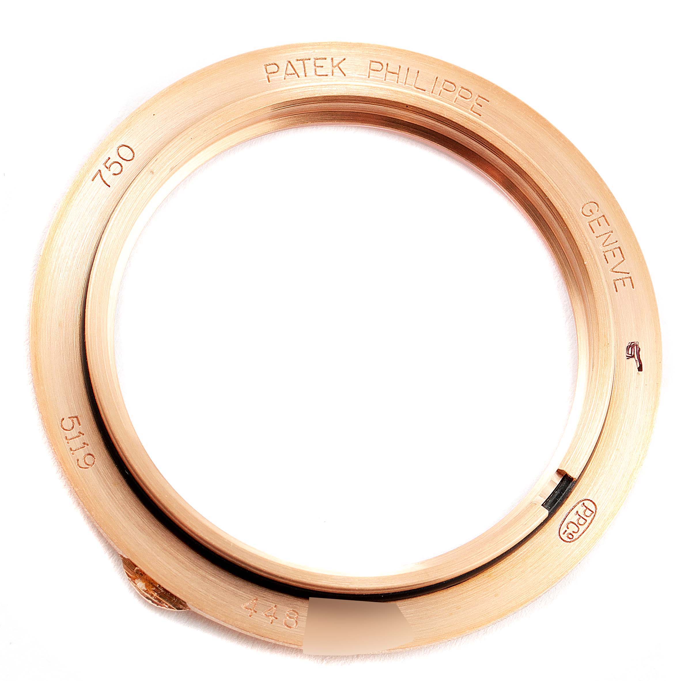 This image shows the bezel of a Patek Philippe Calatrava 5119R Men's Rose Gold White Dial 5119R Men's Rose Gold White Dial model watch.