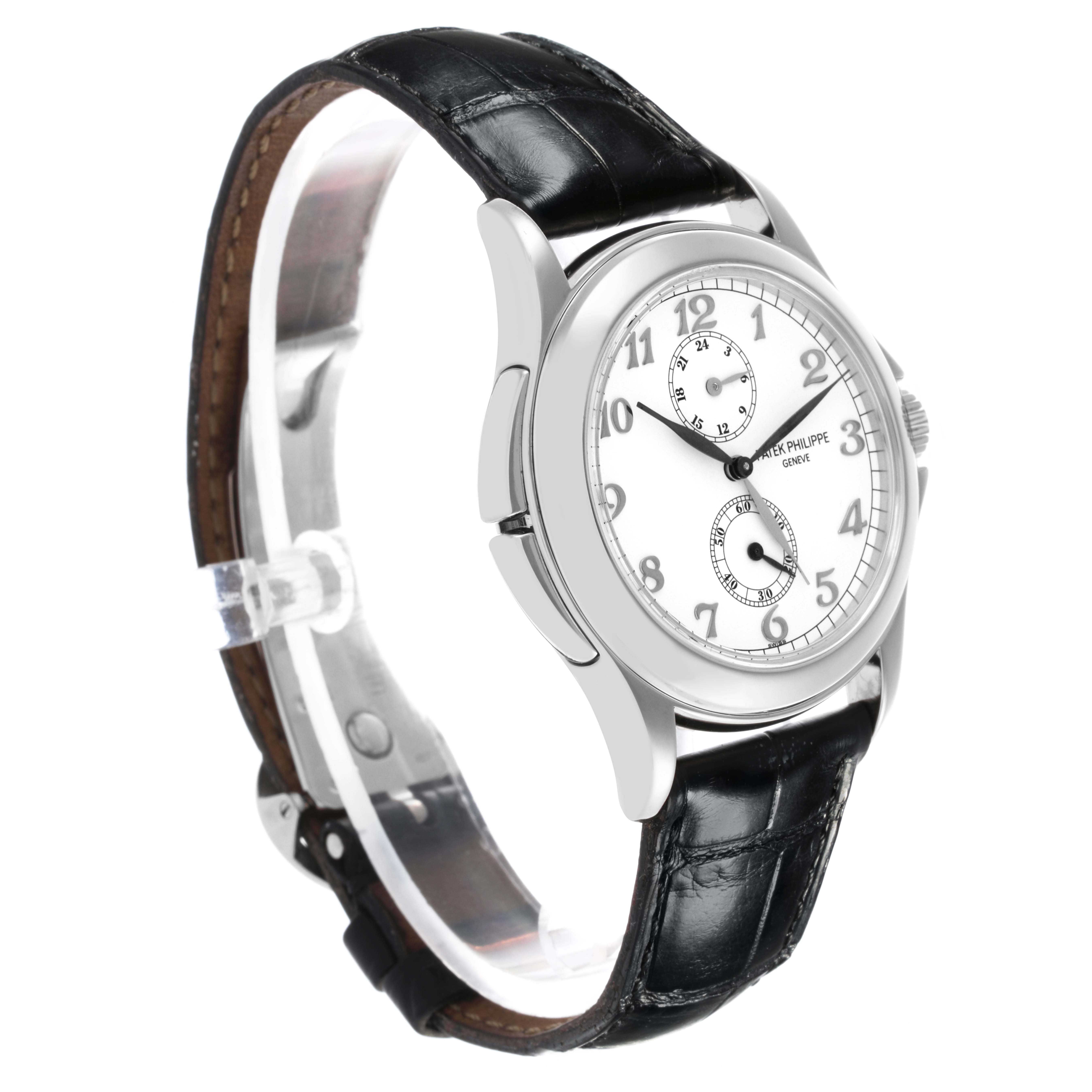 The Patek Philippe Calatrava 5134G Men's White Gold White Dial 5134G Men's White Gold White Dial watch is shown at a side angle, highlighting its white dial and black leather strap.