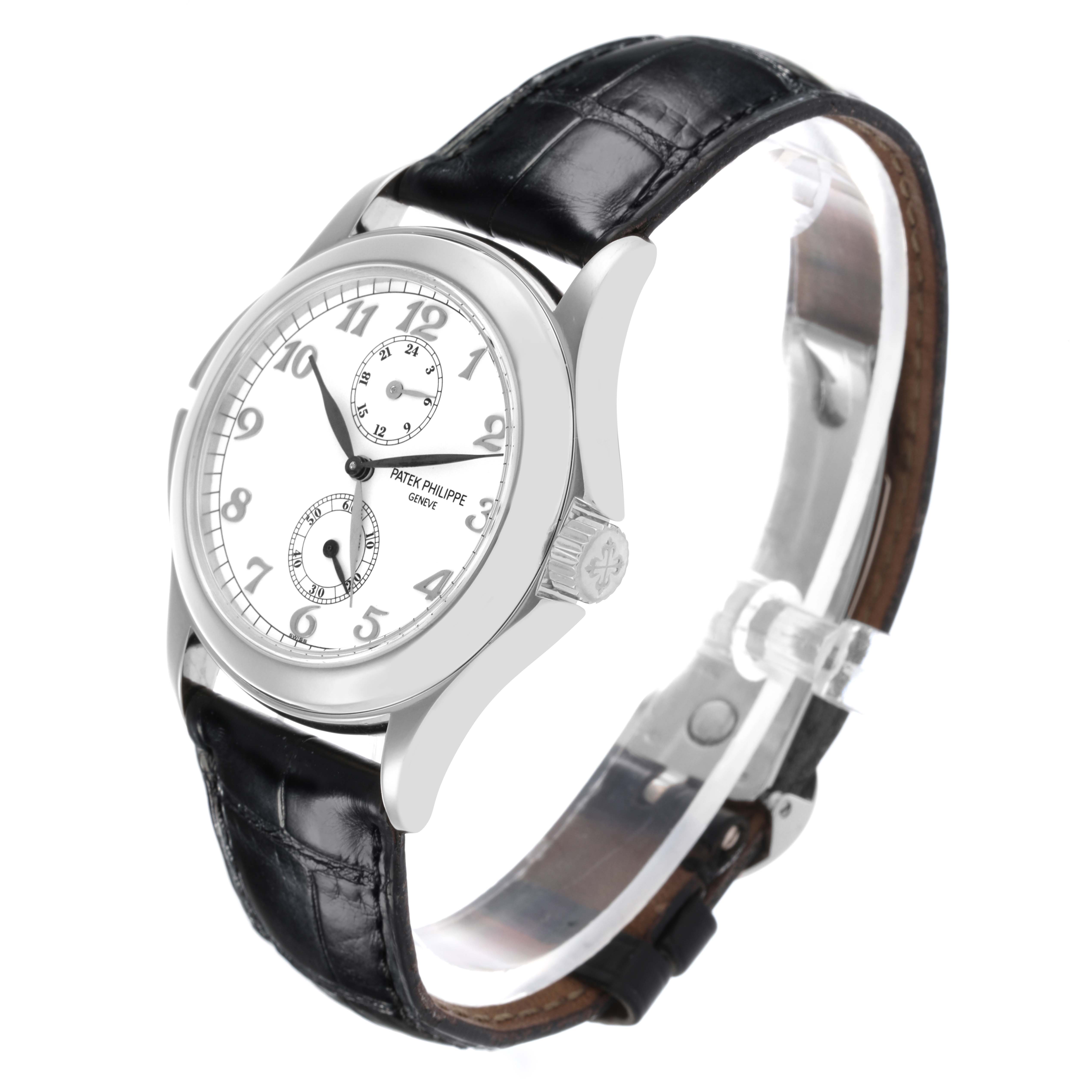 The Calatrava by Patek Philippe is shown at a three-quarter angle, highlighting the dial, case, and leather strap.