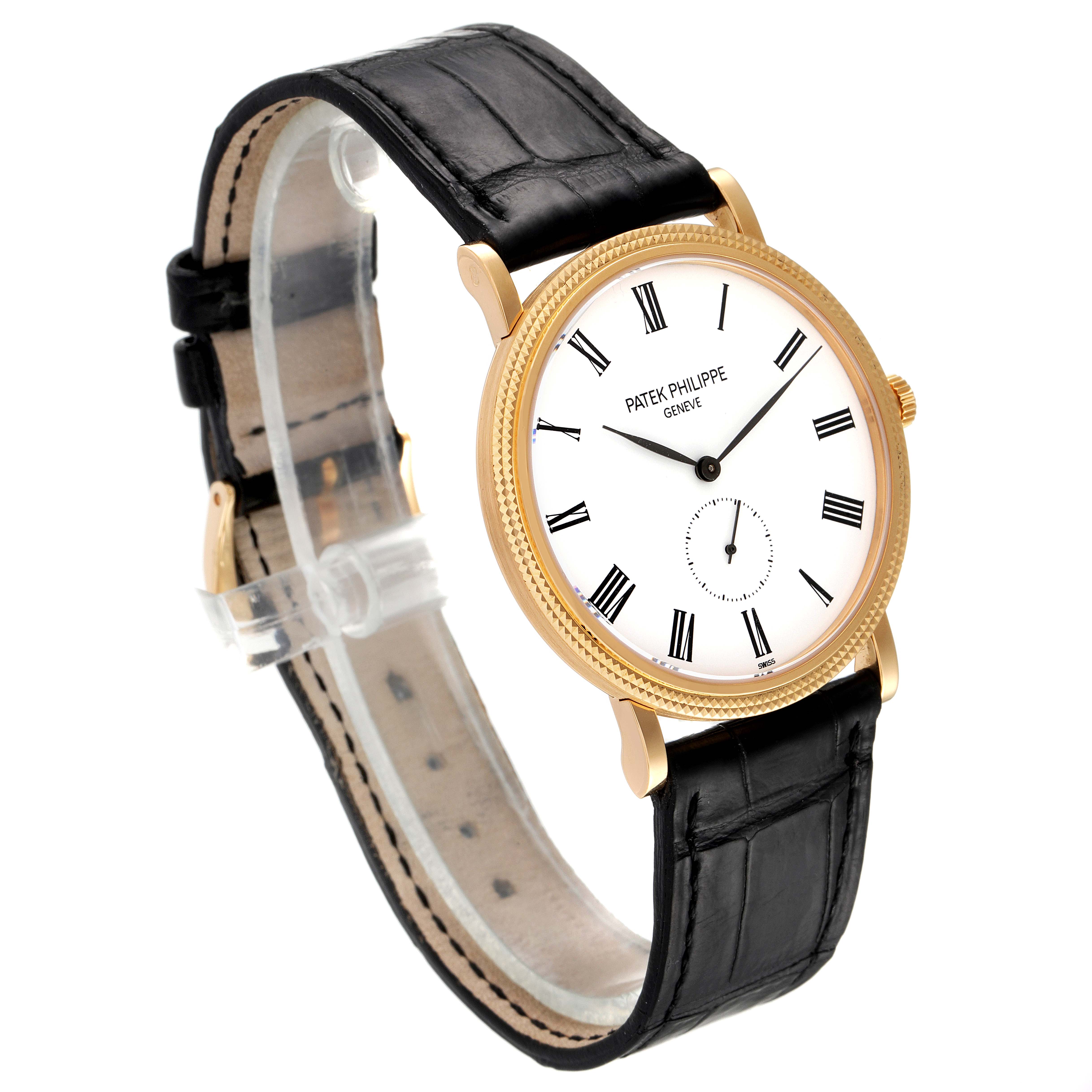 The image shows a Patek Philippe Calatrava 5119J Men's Yellow Gold White Dial 5119J Men's Yellow Gold White Dial watch from an angled side view, revealing the dial, strap, and case.