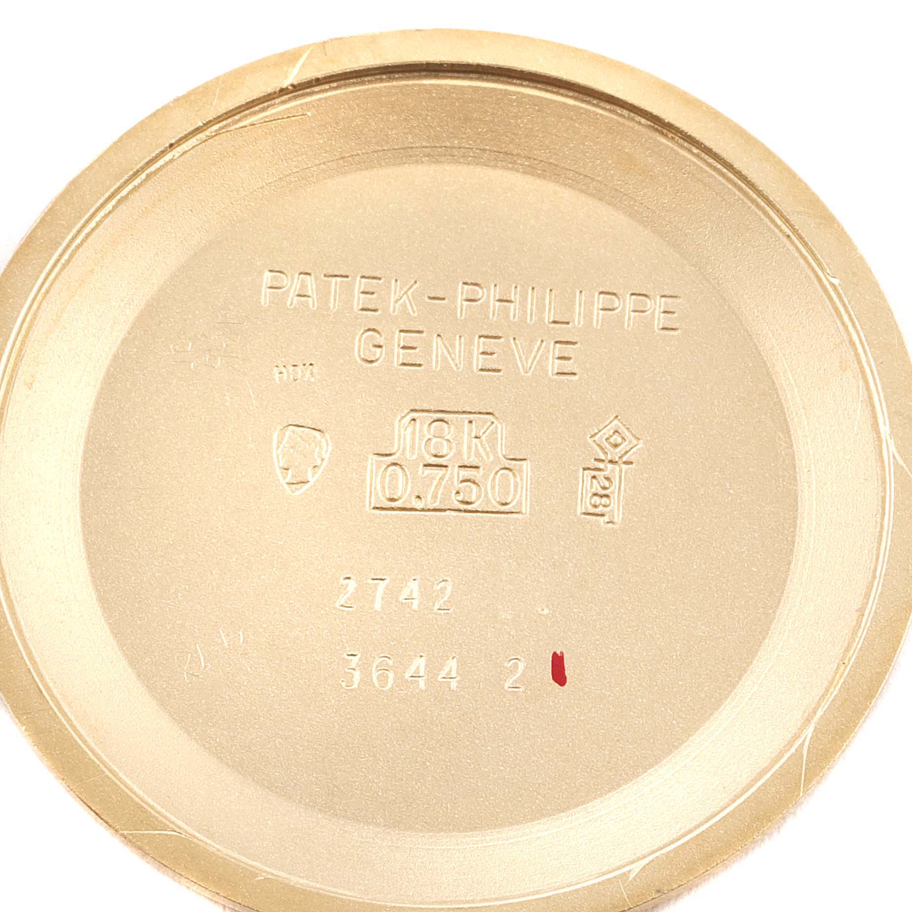 This image shows the inside case back of the Patek Philippe Golden Ellipse 3644 Men's Yellow Gold Champagne Dial 3644 Men's Yellow Gold Champagne Dial watch, indicating 18K gold composition.