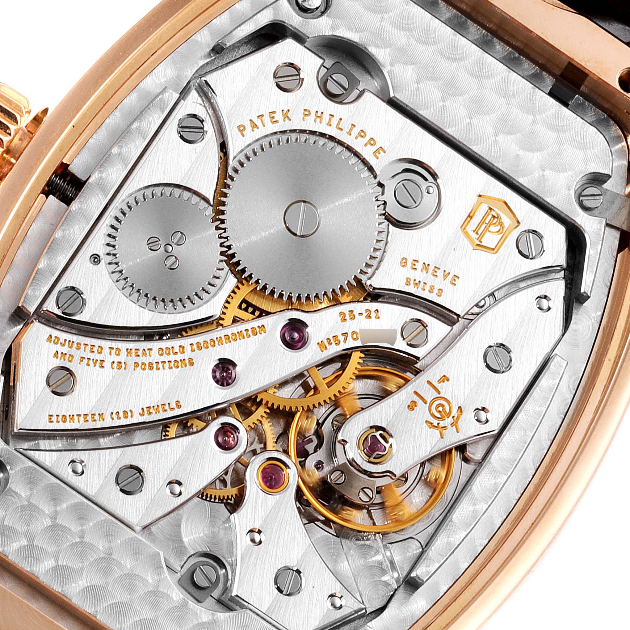 This is a close-up view of the movement and inner mechanical parts of the Patek Philippe Gondolo 5098R Men's Rose Gold Silver Dial 5098R Men's Rose Gold Silver Dial watch.