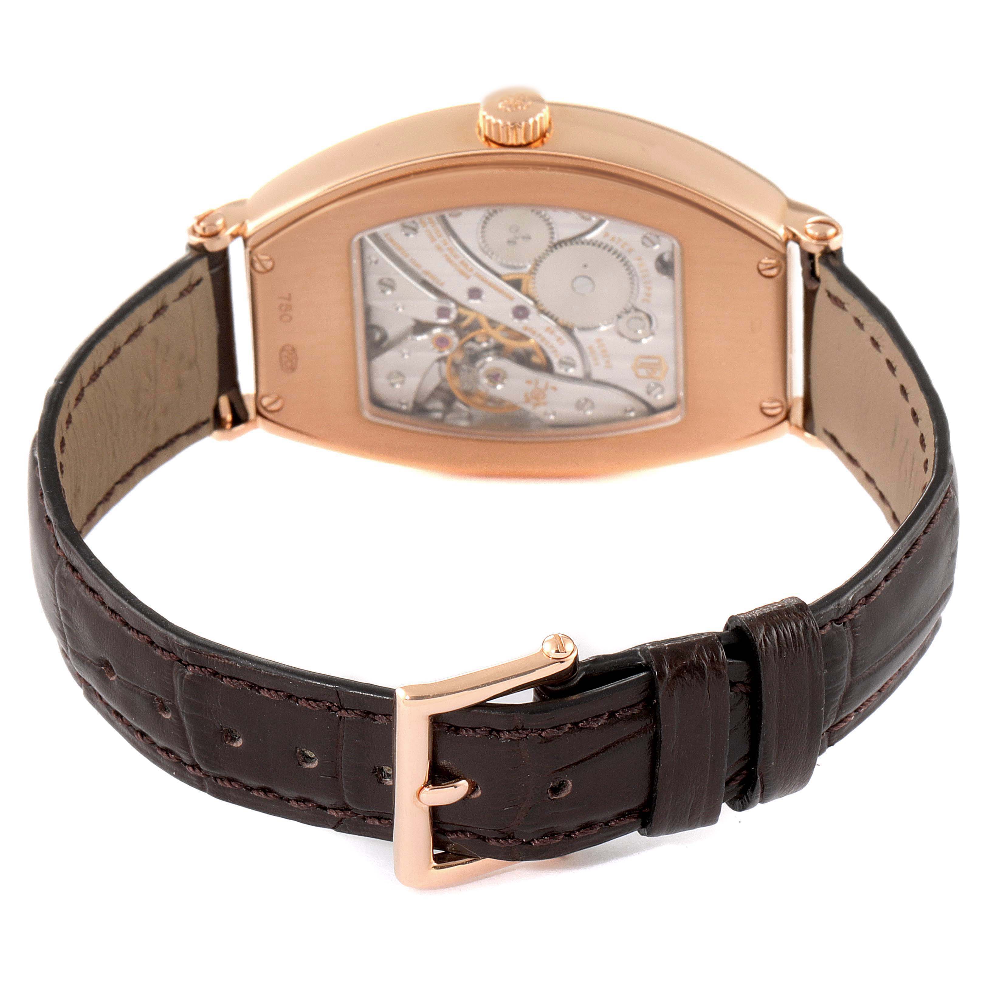 The image shows the back view of a Patek Philippe Gondolo 5098R Men's Rose Gold Silver Dial 5098R Men's Rose Gold Silver Dial watch, highlighting the movement and leather strap with buckle.