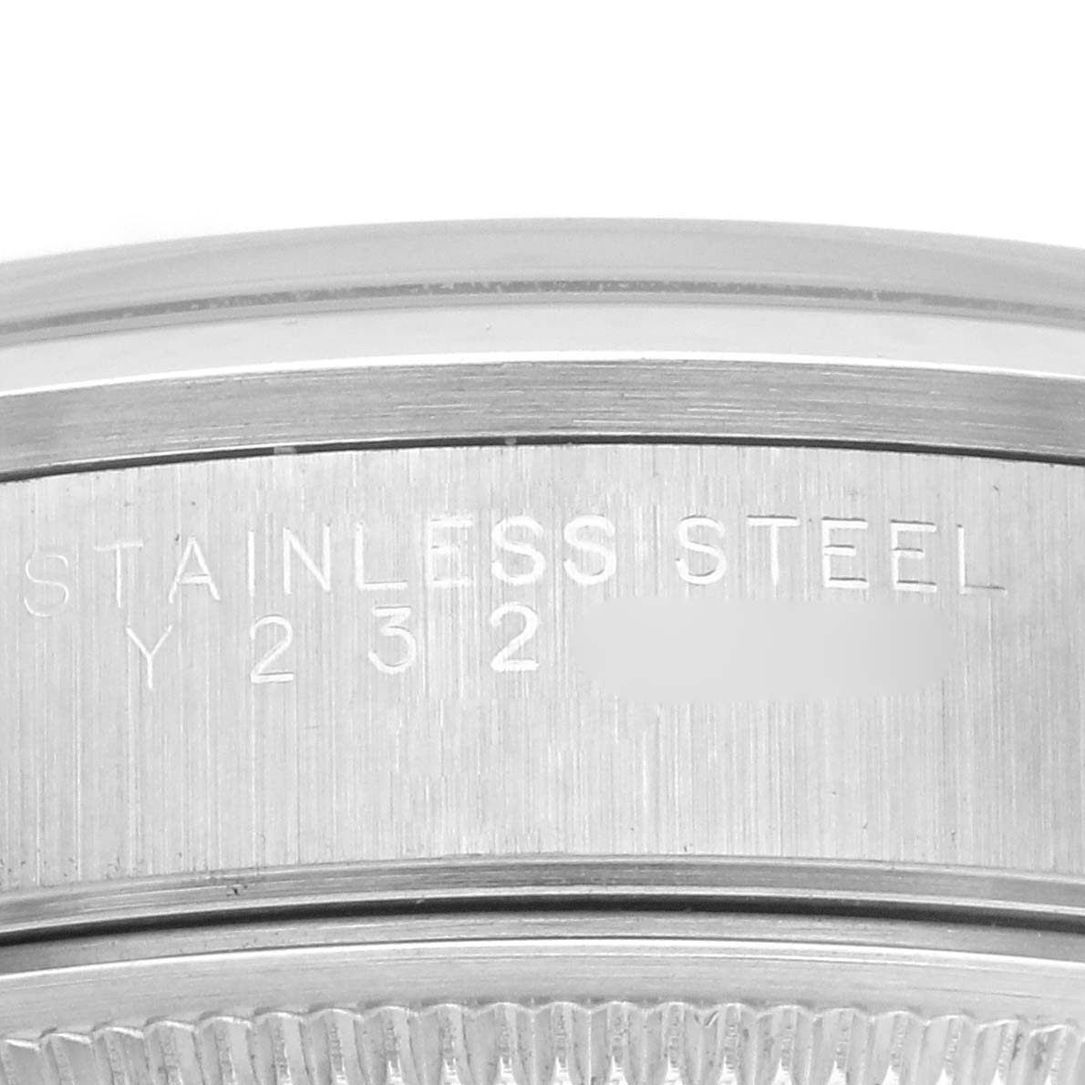 The image shows a close-up of the side of a Rolex Air-King 14000M Men's Stainless Steel Blue Dial 14000M Men's Stainless Steel Blue Dial, focusing on the stainless steel case and engraved serial.