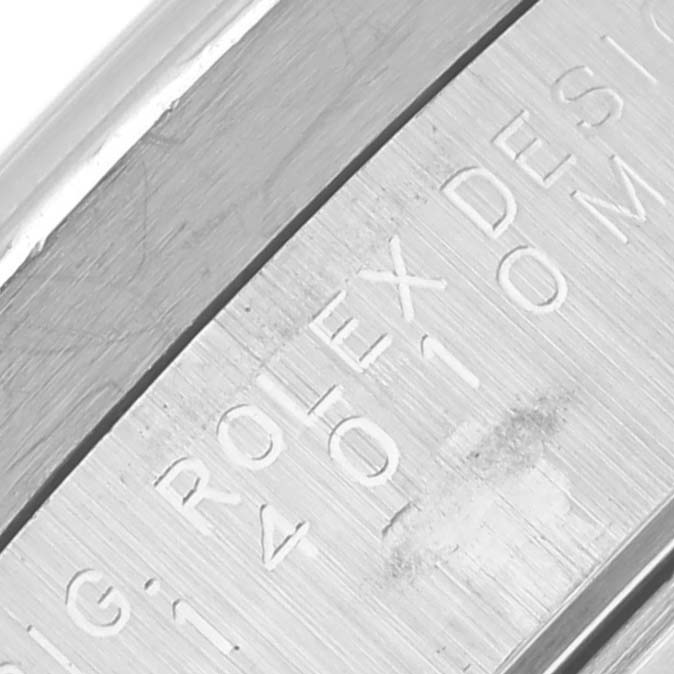 The image shows an angled close-up of the engraved side of a Rolex Air-King 14010M Men's Stainless Steel Black Dial 14010M Men's Stainless Steel Black Dial watch case.