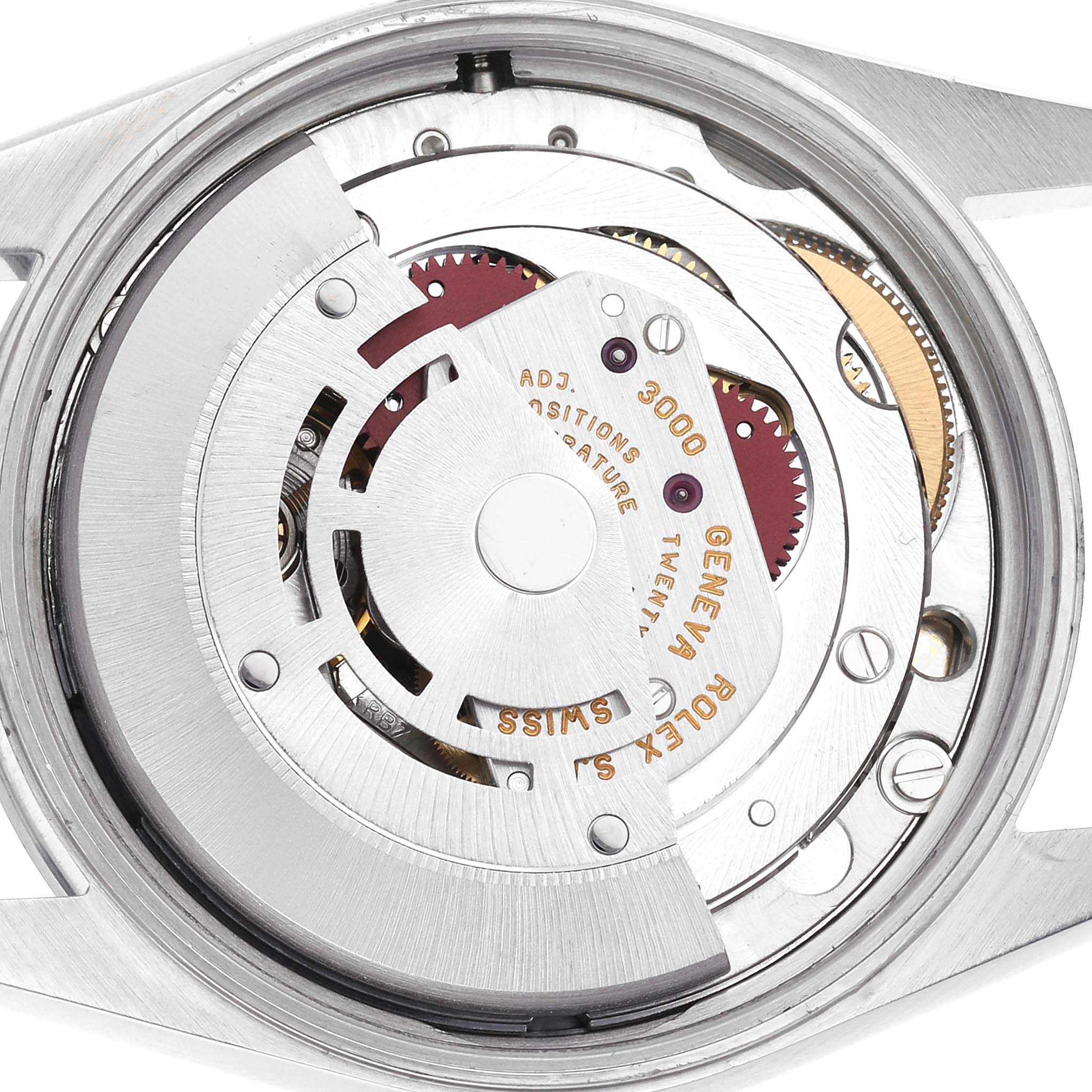 The image shows the movement of a Rolex Air-King 14000 Men's Stainless Steel Silver Dial 14000 Men's Stainless Steel Silver Dial watch from a top-down angle, highlighting gears and inscriptions.
