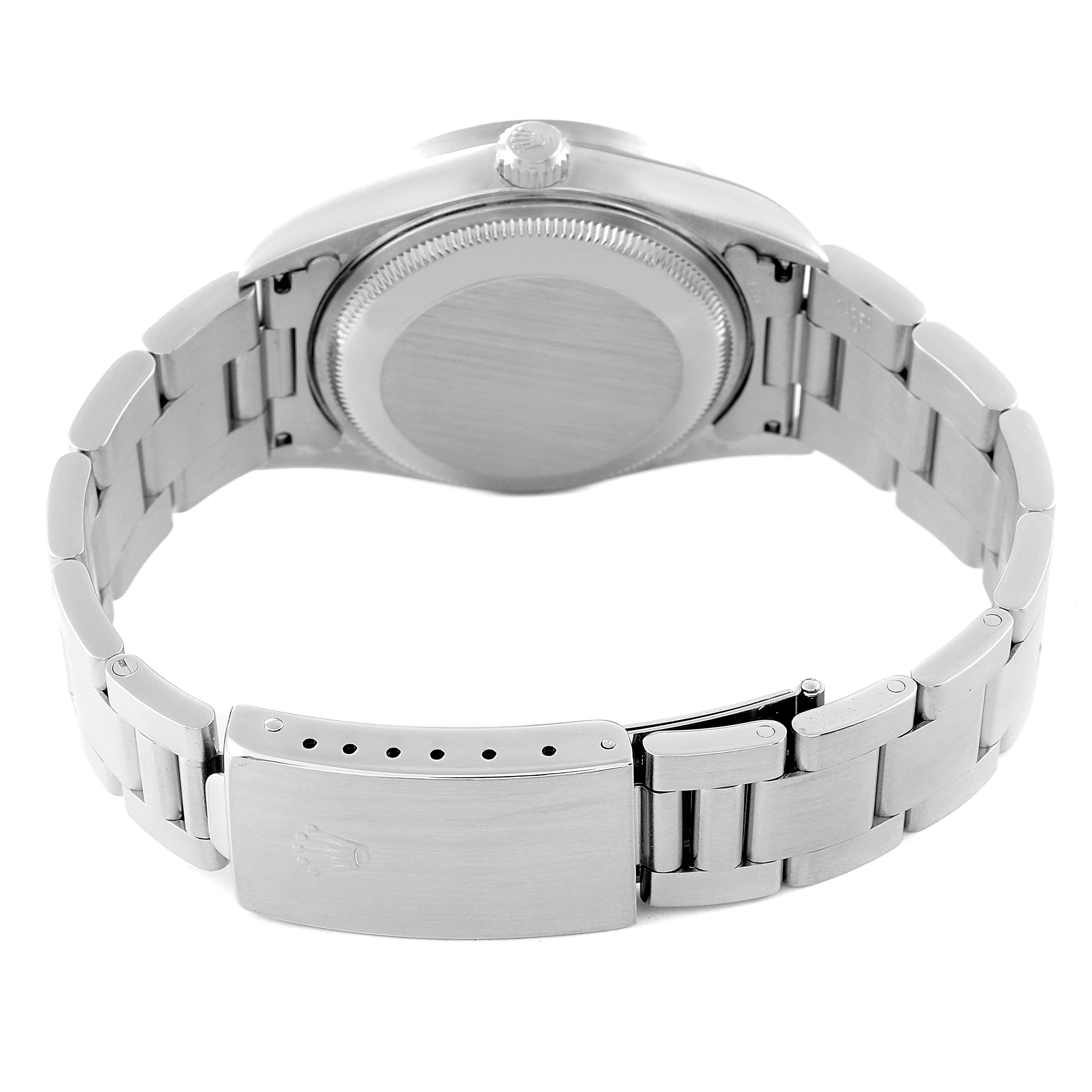 The image shows the back view of a Rolex Date 15210 Men
s Stainless Steel Black Dial 15210 Men
s Stainless Steel Black Dial watch, focusing on the case back and the bracelet with its clasp.