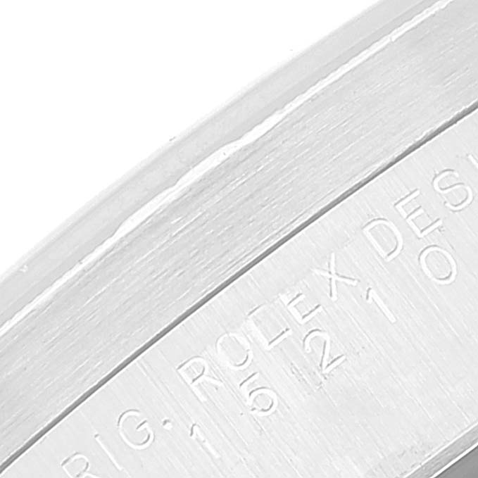 The image shows a close-up of the case
s side engraving of a Rolex Date 15210 Men
s Stainless Steel Black Dial 15210 Men
s Stainless Steel Black Dial model watch.