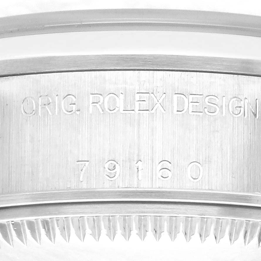 The image shows the side profile of the Rolex Date 79160 Women's Stainless Steel Black Dial 79160 Women's Stainless Steel Black Dial model, highlighting the engraved design and model number.