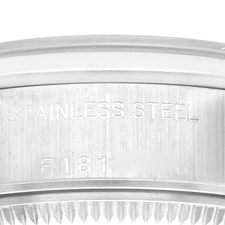 The image shows the side view of a Rolex Date 79160 Women's Stainless Steel Black Dial 79160 Women's Stainless Steel Black Dial model highlighting the stainless steel inscription.