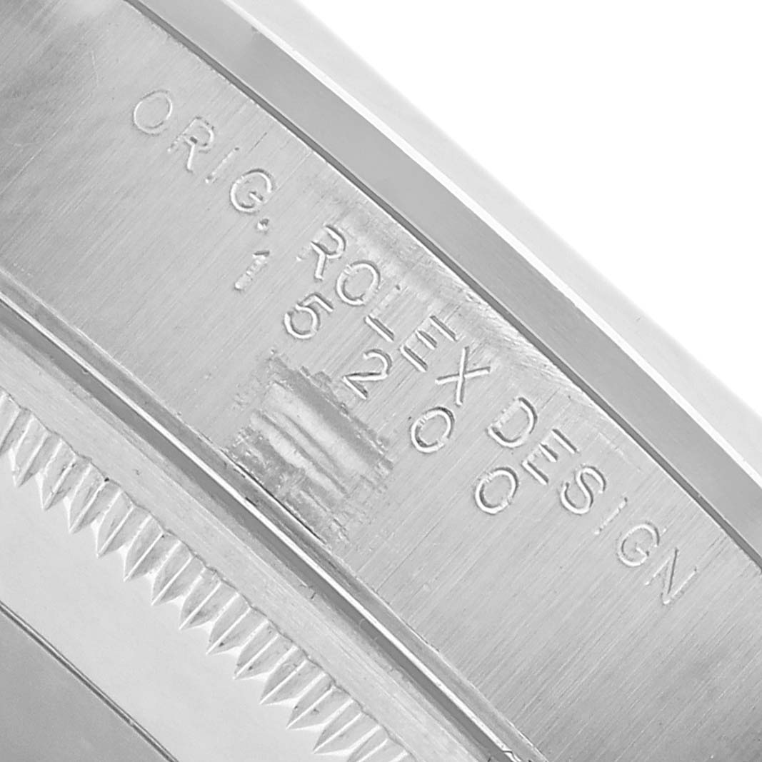 The image shows a close-up of the case side of a Rolex Date 15200 Men's Stainless Steel Black Dial watch, highlighting the engraving.