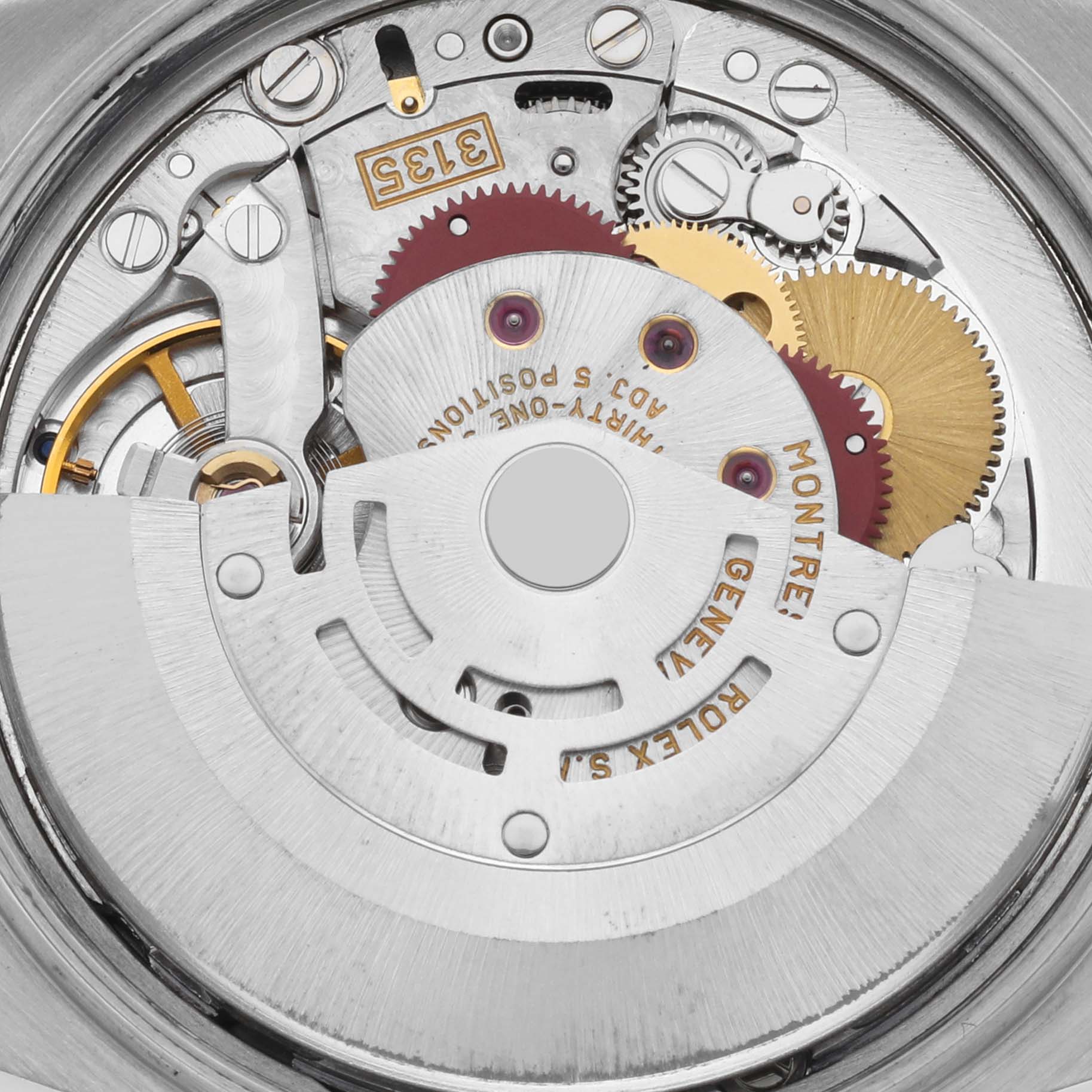 The image shows a close-up view of the movement of a Rolex Date 15210 Men's Stainless Steel Blue Dial 15210 Men's Stainless Steel Blue Dial model, highlighting gears and components of the mechanism.