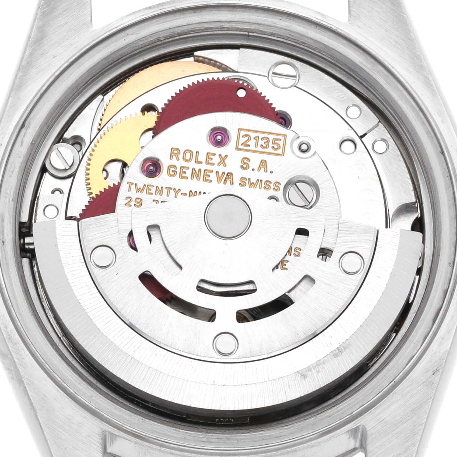 The image shows the movement of a Rolex Date 69160 Women's Stainless Steel Blue Dial 69160 Women's Stainless Steel Blue Dial model watch viewed from the back, displaying gears and rotor mechanism.