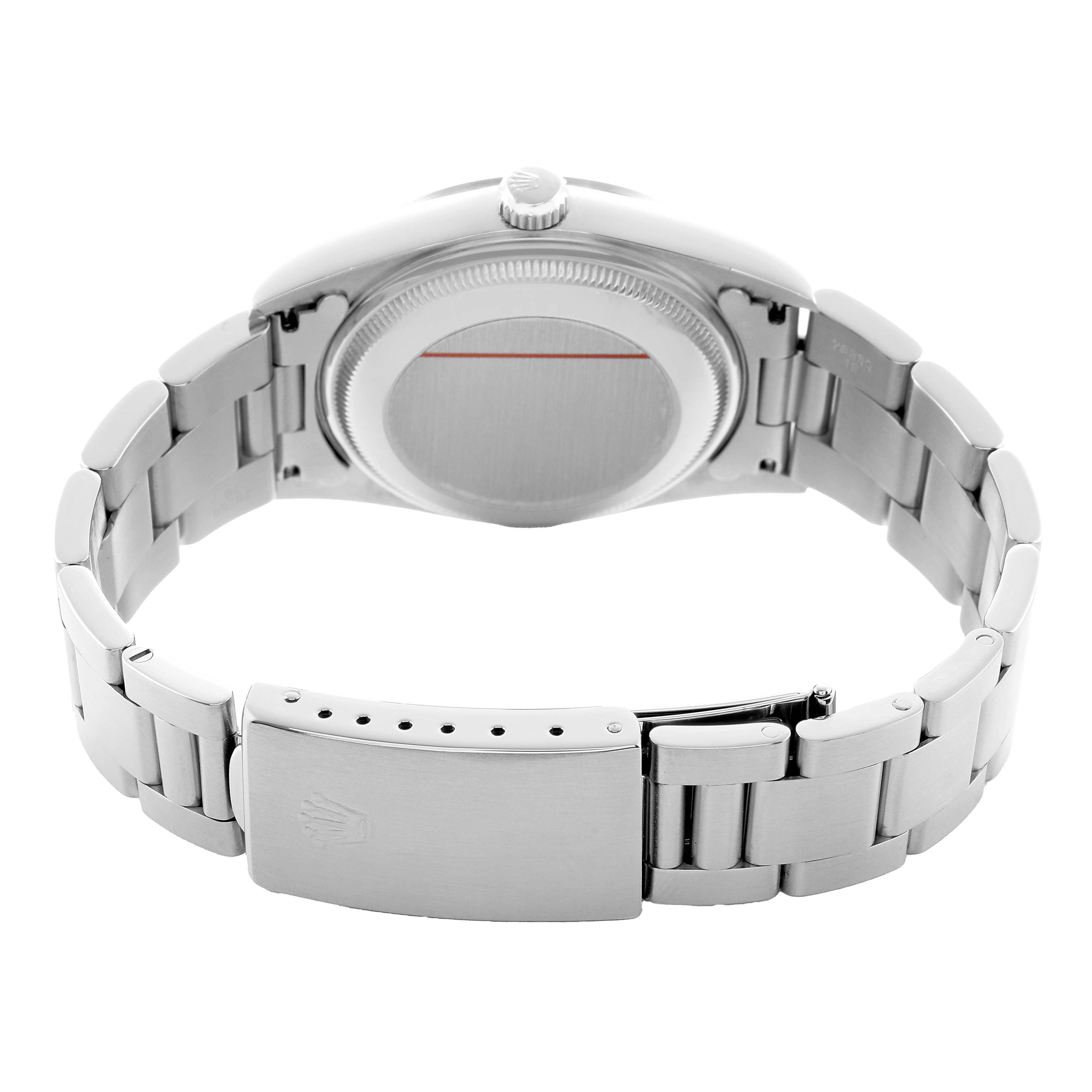 The image shows the back view of a Rolex Date 15200 Men's Stainless Steel Silver Dial watch, highlighting the case back and bracelet clasp.