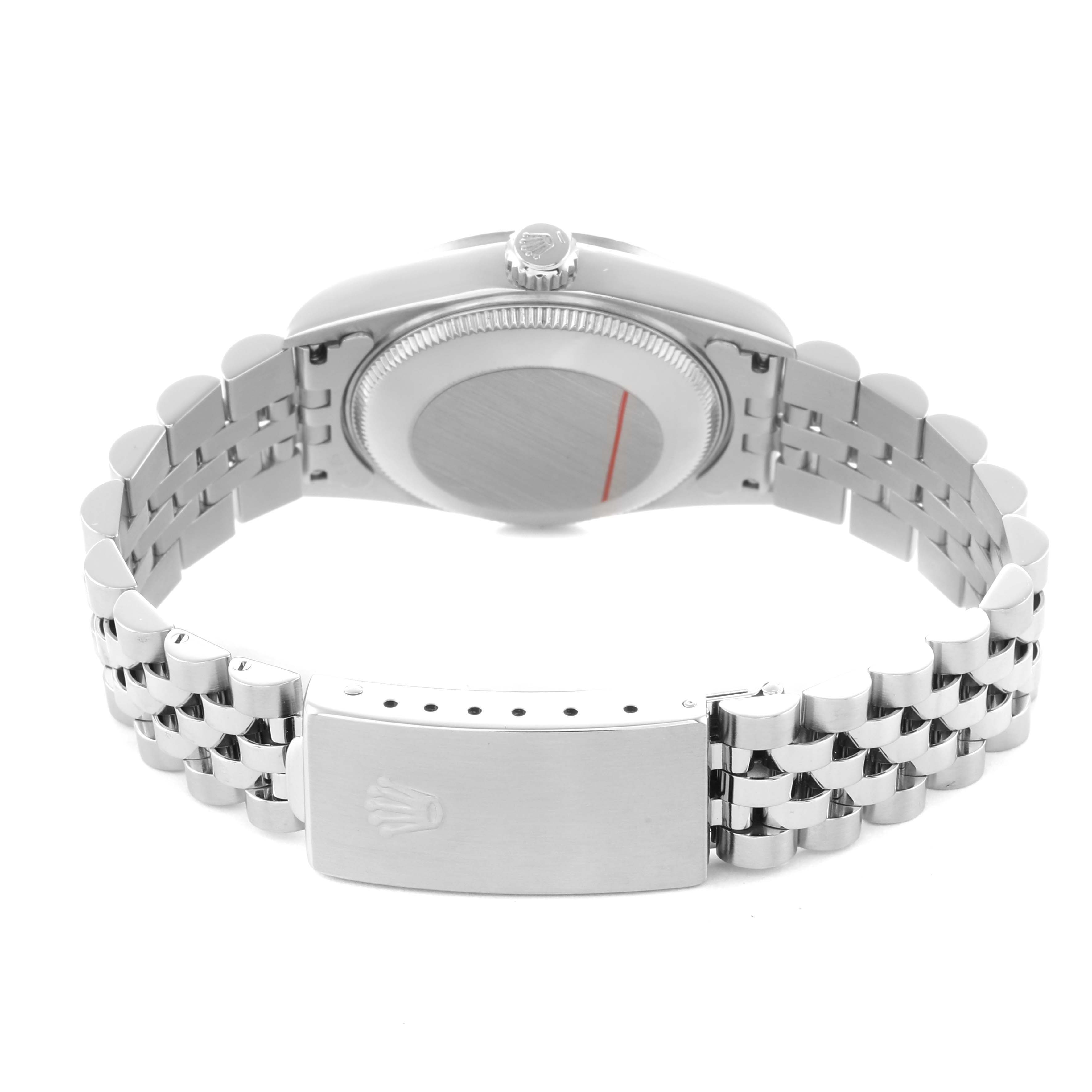 The image shows the back of the Rolex Datejust 68274 Women's Stainless Steel Silver Dial, highlighting the case back, crown, and bracelet clasp.