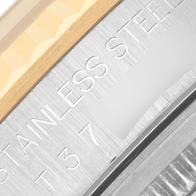 The image shows a close-up of the side engraving on a Rolex Datejust 16233 Men's Steel and Gold (two tone) Black Dial 16233 Men's Steel and Gold (two tone) Black Dial, highlighting the words "Stainless Steel."