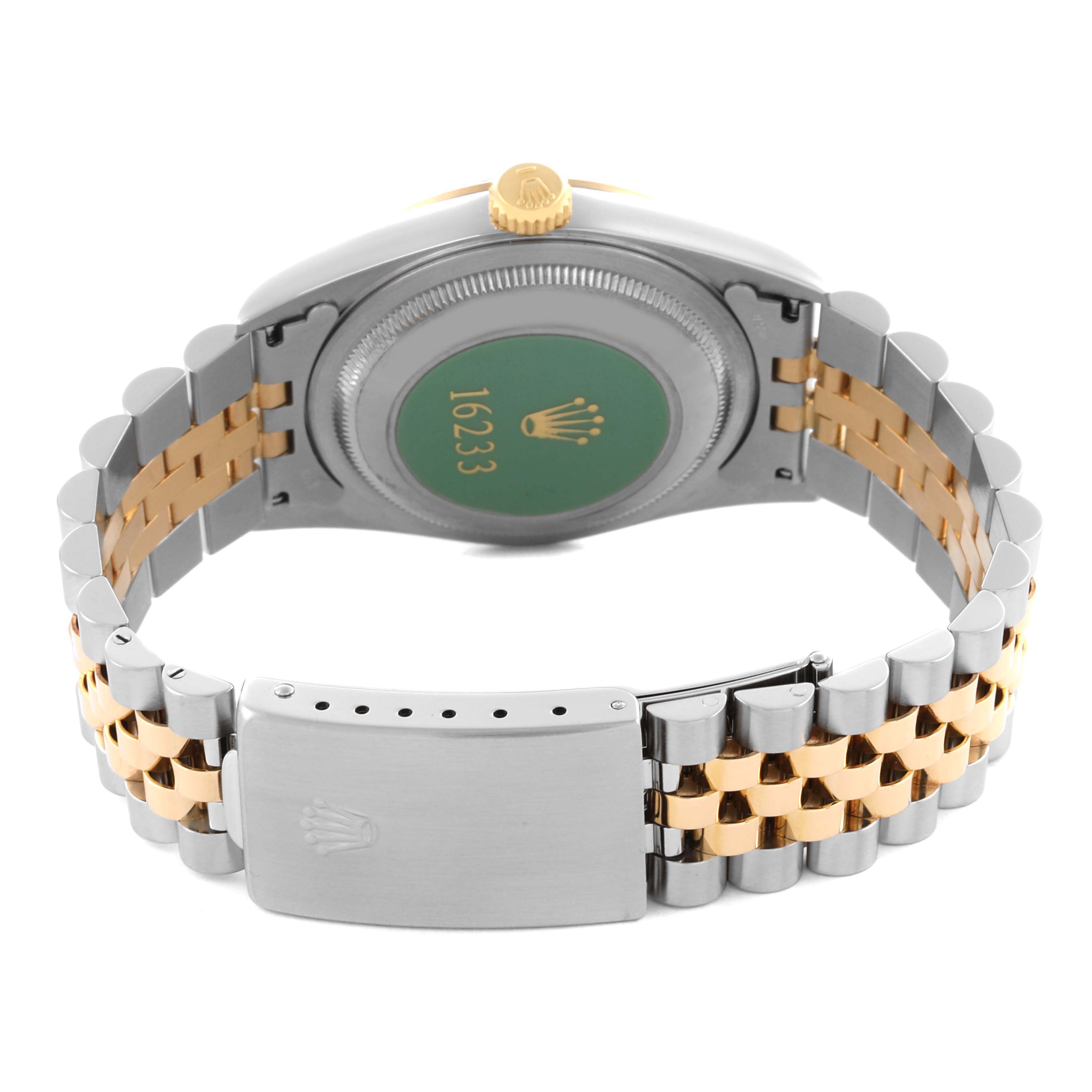 The image shows the back and clasp of a Rolex Datejust 16233 Men's Steel and Gold (two tone) Black Dial 16233 Men's Steel and Gold (two tone) Black Dial, highlighting its two-tone bracelet and case back.