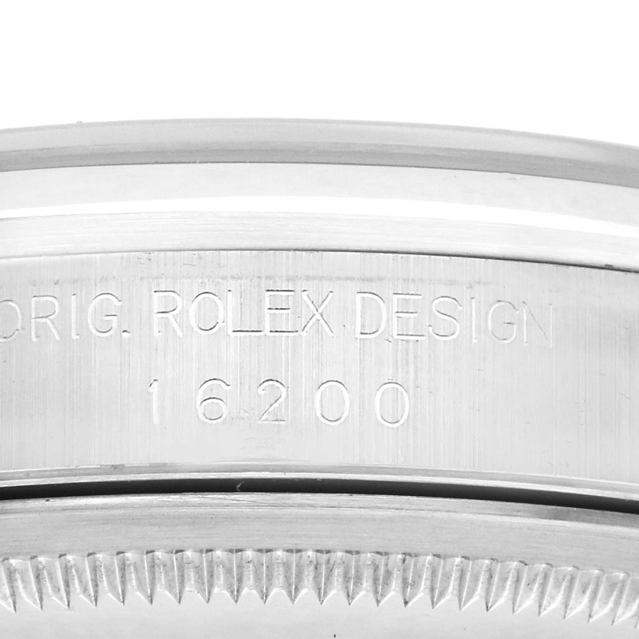 The image shows an angled view of a Rolex Date 16200 Men's Stainless Steel Black Dial 16200 Men's Stainless Steel Black Dial model's watch case side with engraved design and model number "16200".