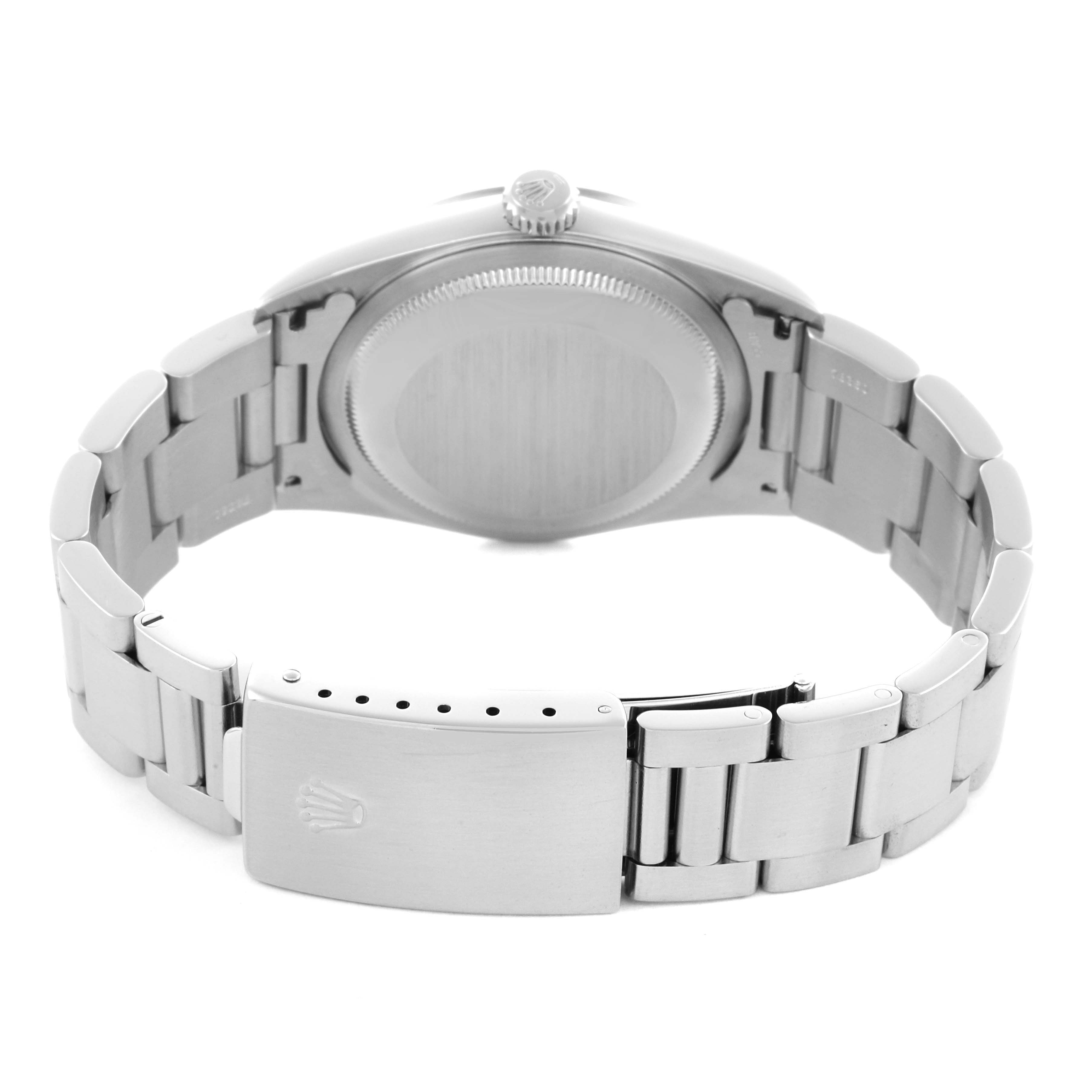 The image shows a Rolex Date 16200 Men's Stainless Steel Black Dial 16200 Men's Stainless Steel Black Dial model from the back, displaying the case back, crown, and bracelet with the clasp.