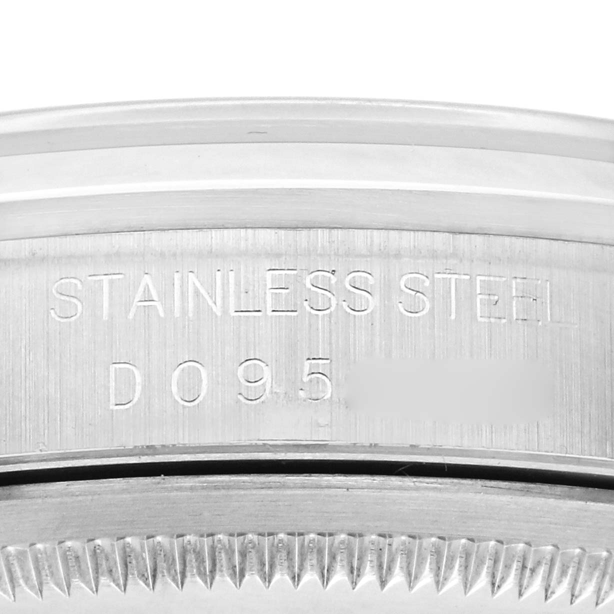 The image shows a close-up of the stainless steel caseback engraving of a Rolex Date 16200 Men's Stainless Steel Black Dial 16200 Men's Stainless Steel Black Dial model.