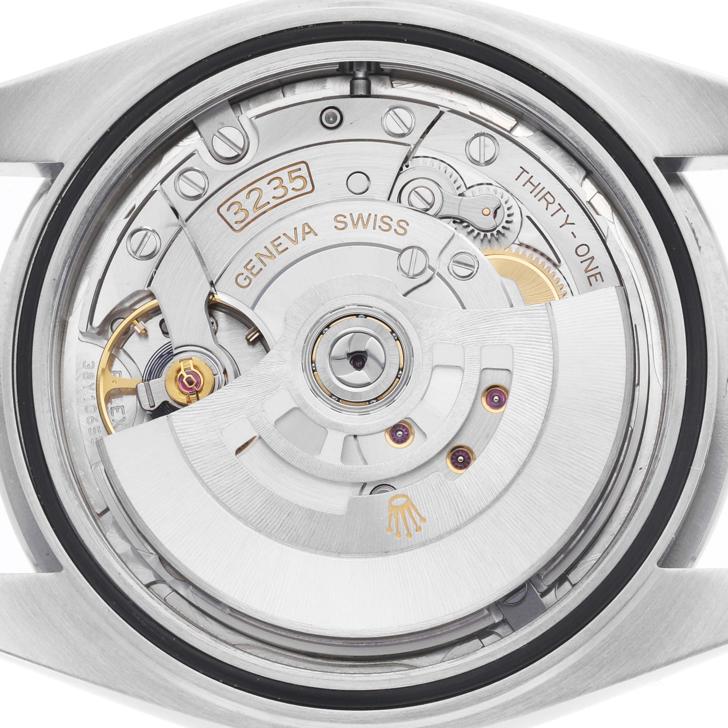 The image shows the movement of a Rolex Datejust 41 126300 Men's Stainless Steel Silver Dial, highlighting the intricate mechanics from a bottom angle.