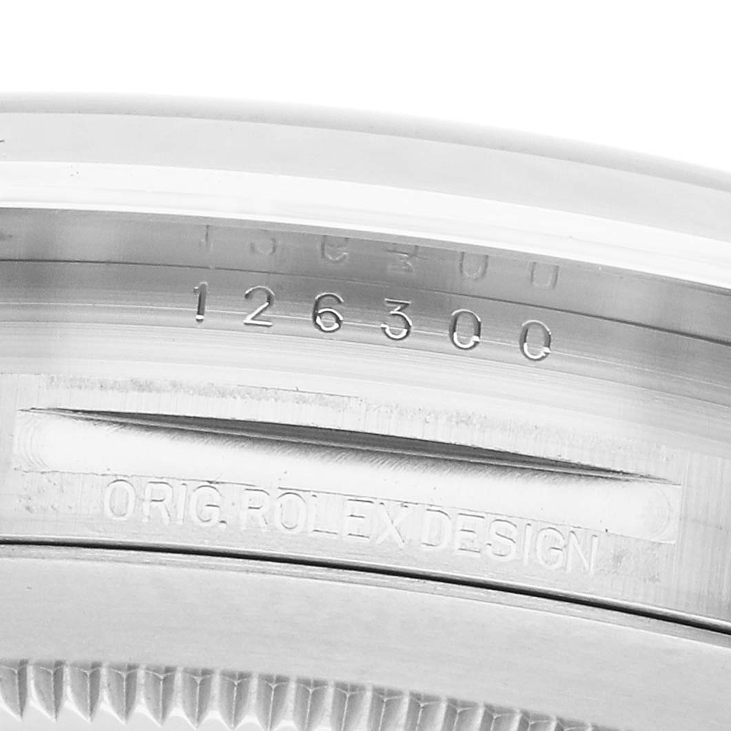 The image shows the side case of a Rolex Datejust 41 126300 Men's Stainless Steel Silver Dial, displaying engravings including the model number.