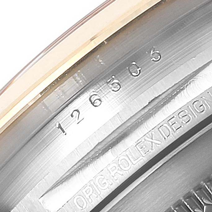 The image shows a macro view of the Rolex Datejust 41 126303 Men's Steel and Gold (two tone) Black Dial 126303 Men's Steel and Gold (two tone) Black Dial model's engraved inner bezel.