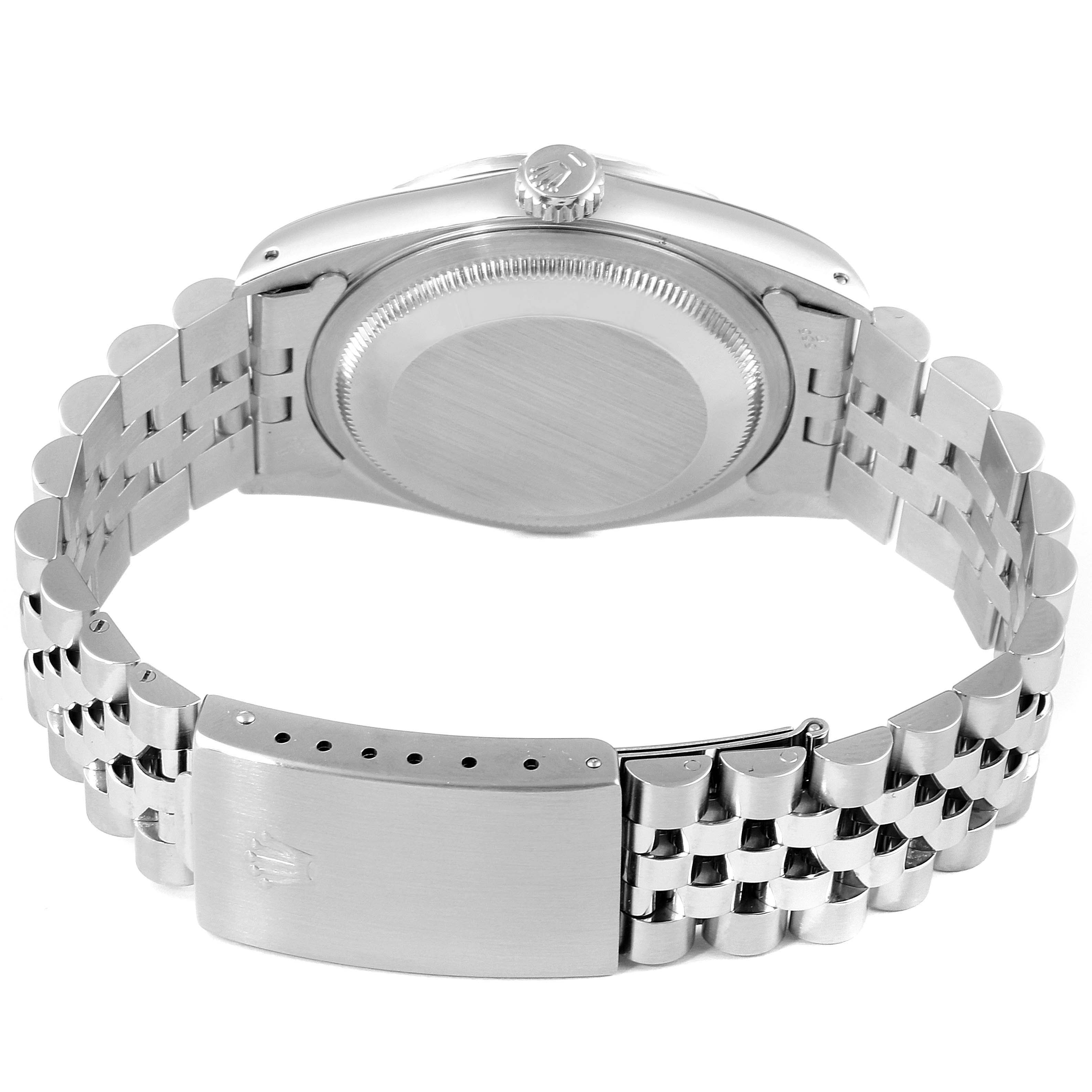 The image shows the back view of a Rolex Datejust 16220 Men
s Stainless Steel Blue Dial 16220 Men
s Stainless Steel Blue Dial watch, including the bracelet, clasp, and case back.