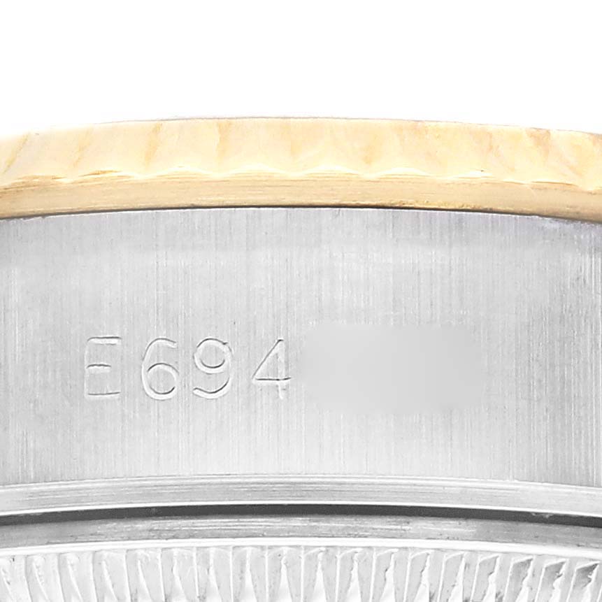 The image shows a close-up of the bezel and serial number on the Rolex Datejust 69173 Women's Steel and Gold (two tone) Champagne Dial 69173 Women's Steel and Gold (two tone) Champagne Dial watch, focusing on the engraved area.