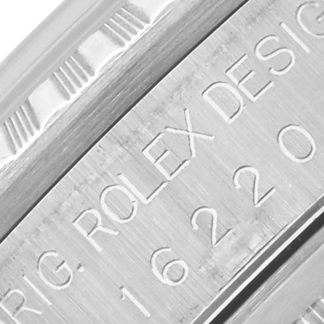 The image shows a close-up of the engraved side of a Rolex Datejust 16220 Men's Stainless Steel Silver Dial 16220 Men's Stainless Steel Silver Dial watch case, highlighting model details.