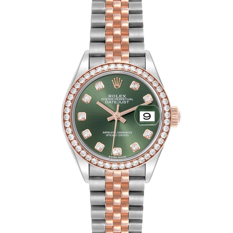 The Rolex Datejust watch is shown from the front, displaying its green dial, date window, and two-tone bracelet.