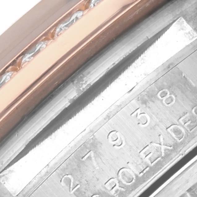 The image shows a close-up of the side of a Rolex Datejust 279381RBR Women's Steel and Gold (two tone) Green Dial 279381RBR Women's Steel and Gold (two tone) Green Dial, highlighting the case with engraved serial numbers.