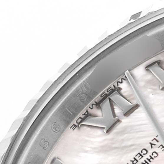 The image shows a close-up of the Rolex Datejust 179174 Women's Stainless Steel Mother of Pearl Dial watch face, highlighting the bezel, part of the dial, and Roman numerals.