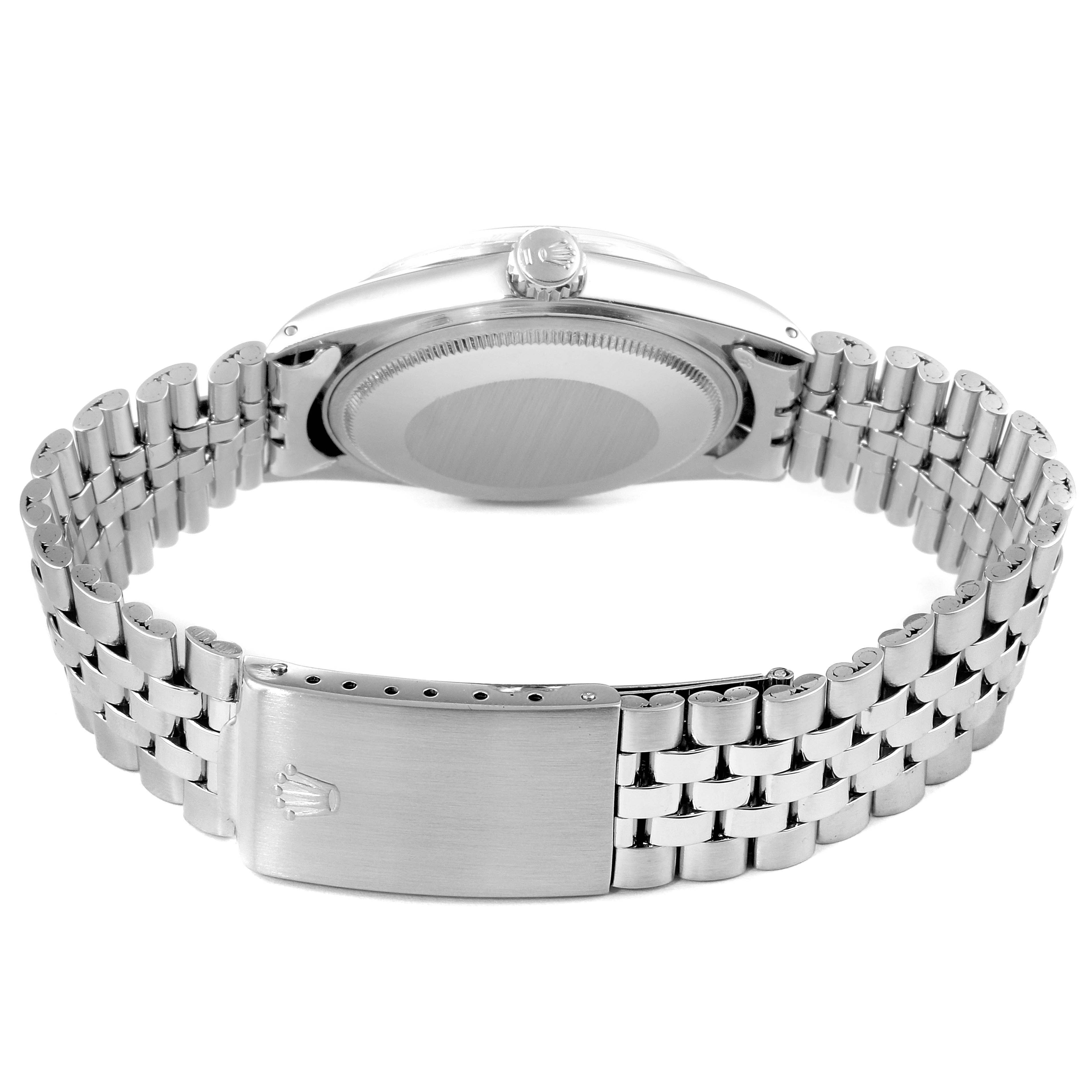 The image shows the back angle of the Vintage Collection Rolex watch, highlighting the case back and the bracelet clasp.