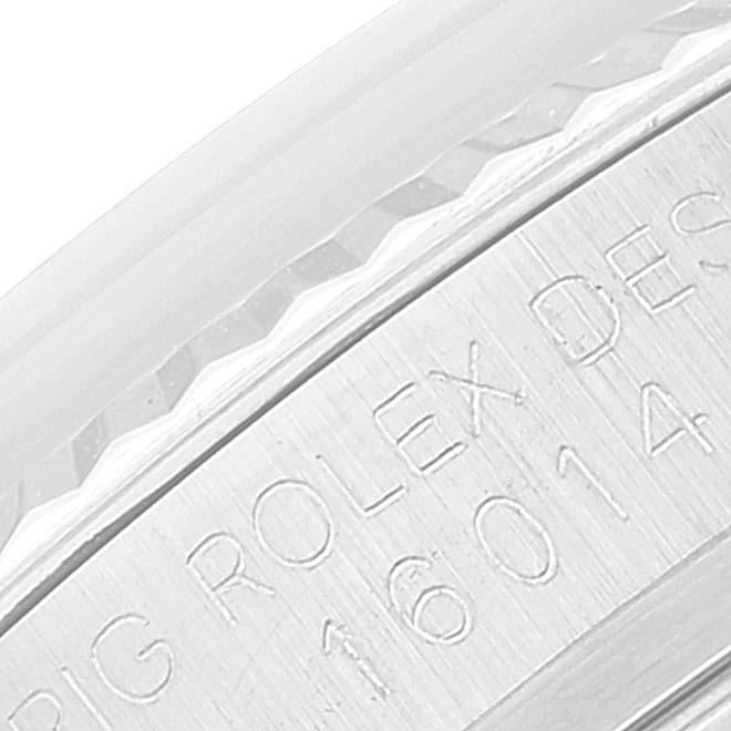 This close-up image shows the engraved serial number on the side case of a Rolex Vintage Collection 16014 Men
s Stainless Steel Silver Dial 16014 Men
s Stainless Steel Silver Dial watch.