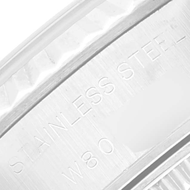 This is a close-up of the engraving on the bezel and case of a Rolex Datejust 69174 Women's Stainless Steel White Dial 69174 Women's Stainless Steel White Dial watch, focusing on "STAINLESS STEEL."