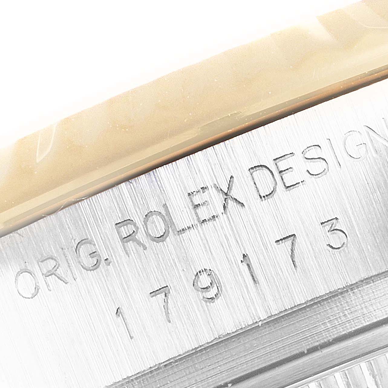 Close-up view of the model and design numbers engraved on the side of a Rolex Datejust 179173 Women
s Steel and Gold (two tone) Silver Dial 179173 Women
s Steel and Gold (two tone) Silver Dial watch.