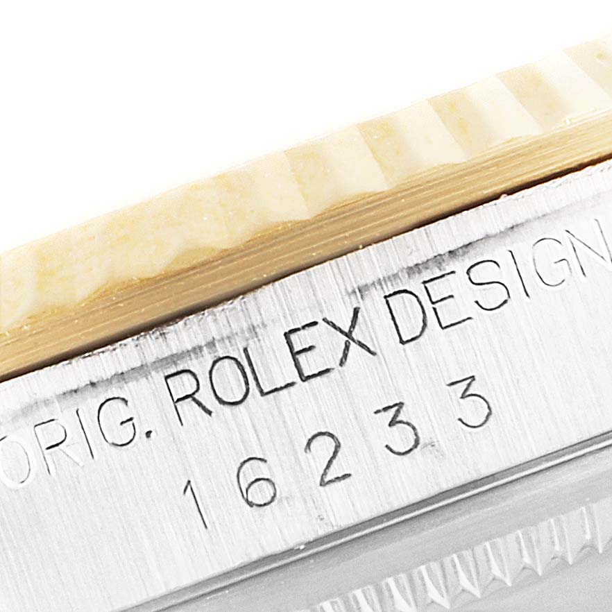 This close-up image shows the case side engraving on a Rolex Datejust 16233 Men
s Steel and Gold (two tone) Mother of Pearl Dial 16233 Men
s Steel and Gold (two tone) Mother of Pearl Dial watch, displaying the text "ORIG. ROLEX DESIGN" and the reference number.